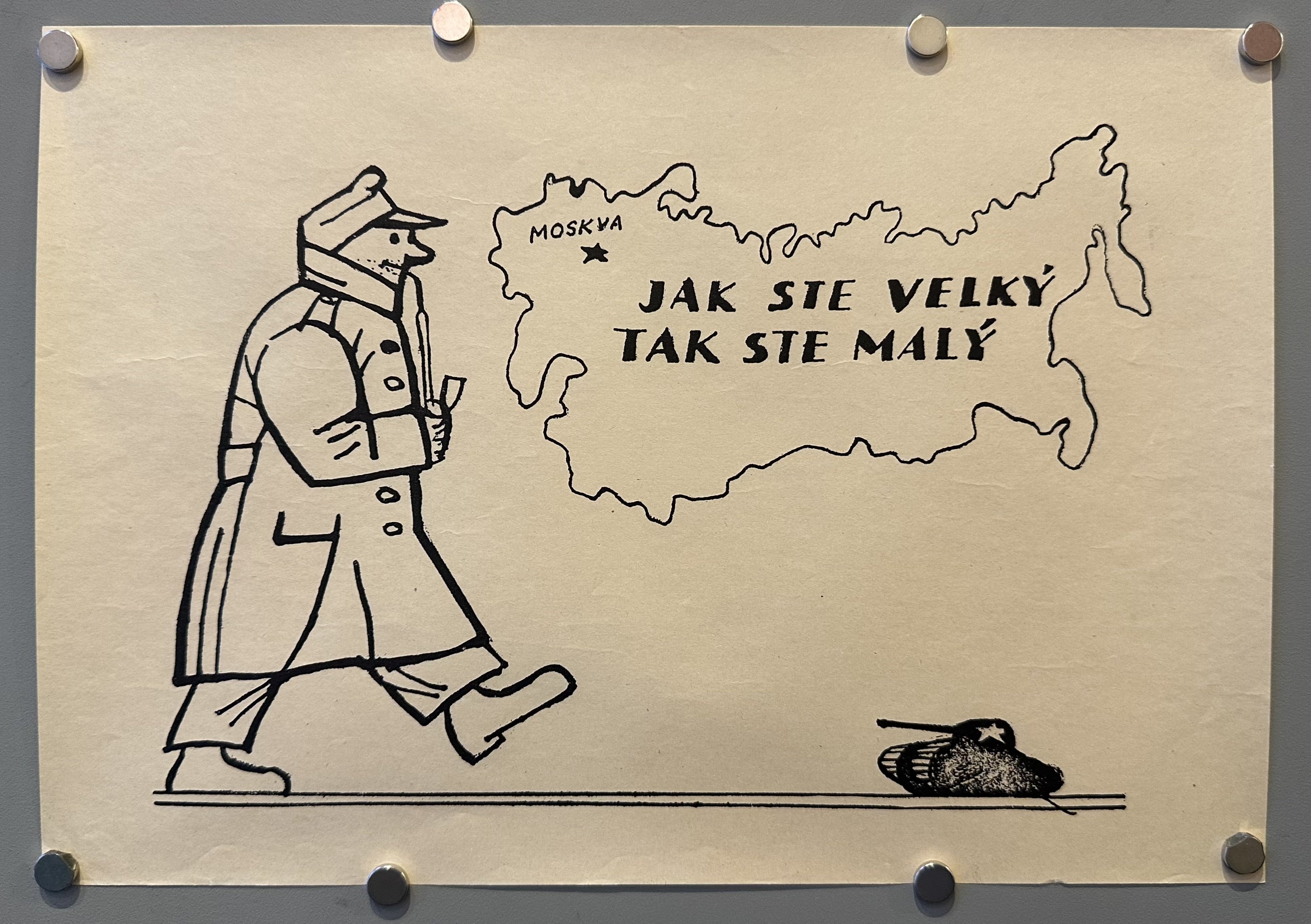 Illustration of a soldier with a pipe walking towards a small tank with a Soviet star on the side, a map of Russia marking Moskva/ Moscow on the wall.