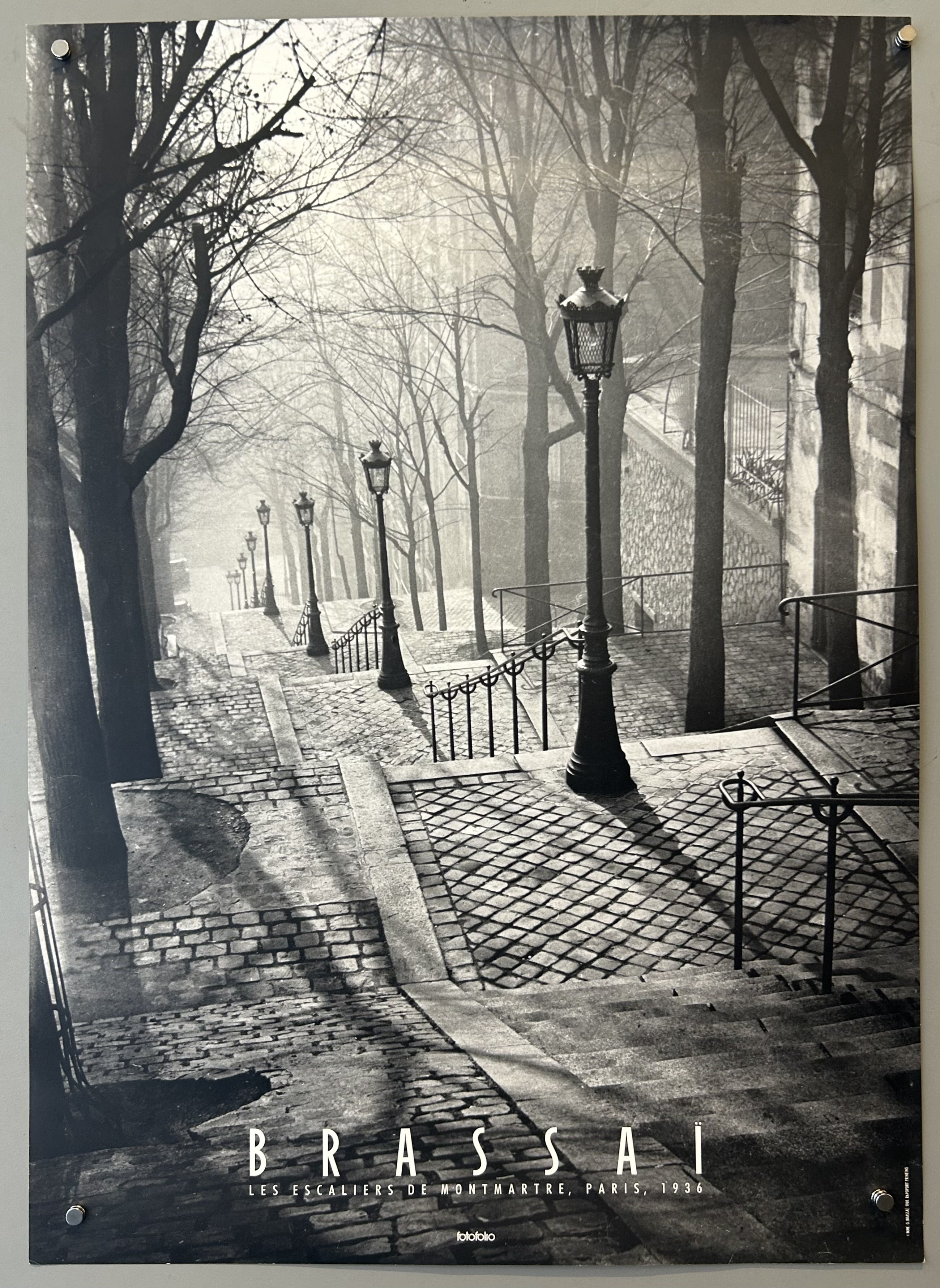 Black and white photograph of stairs with light lamps aligning
