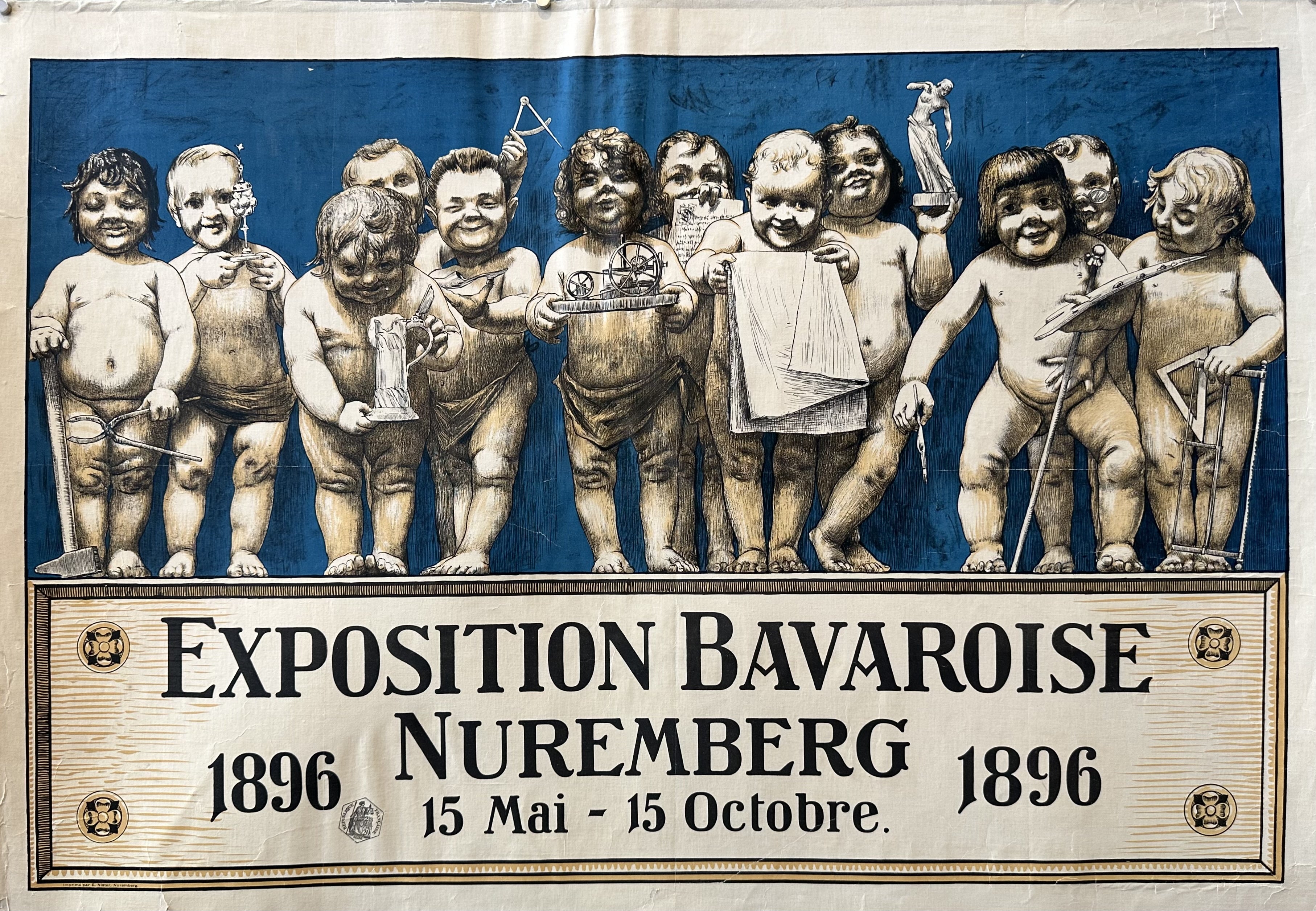 12 putti hold symbols of culture against a blue background in this poster for an exhibition in Nuremberg.