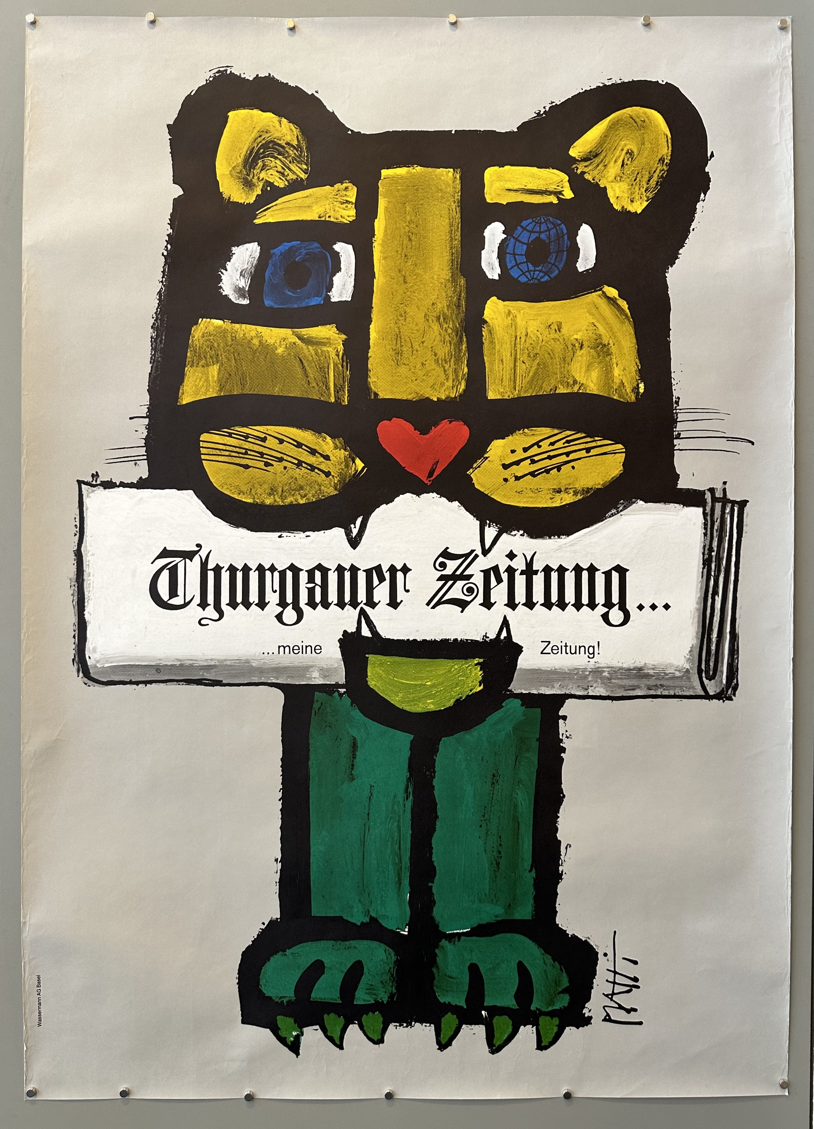 Illustrated lion holding Thurgauer Zeitung newspaper in its mouth.
