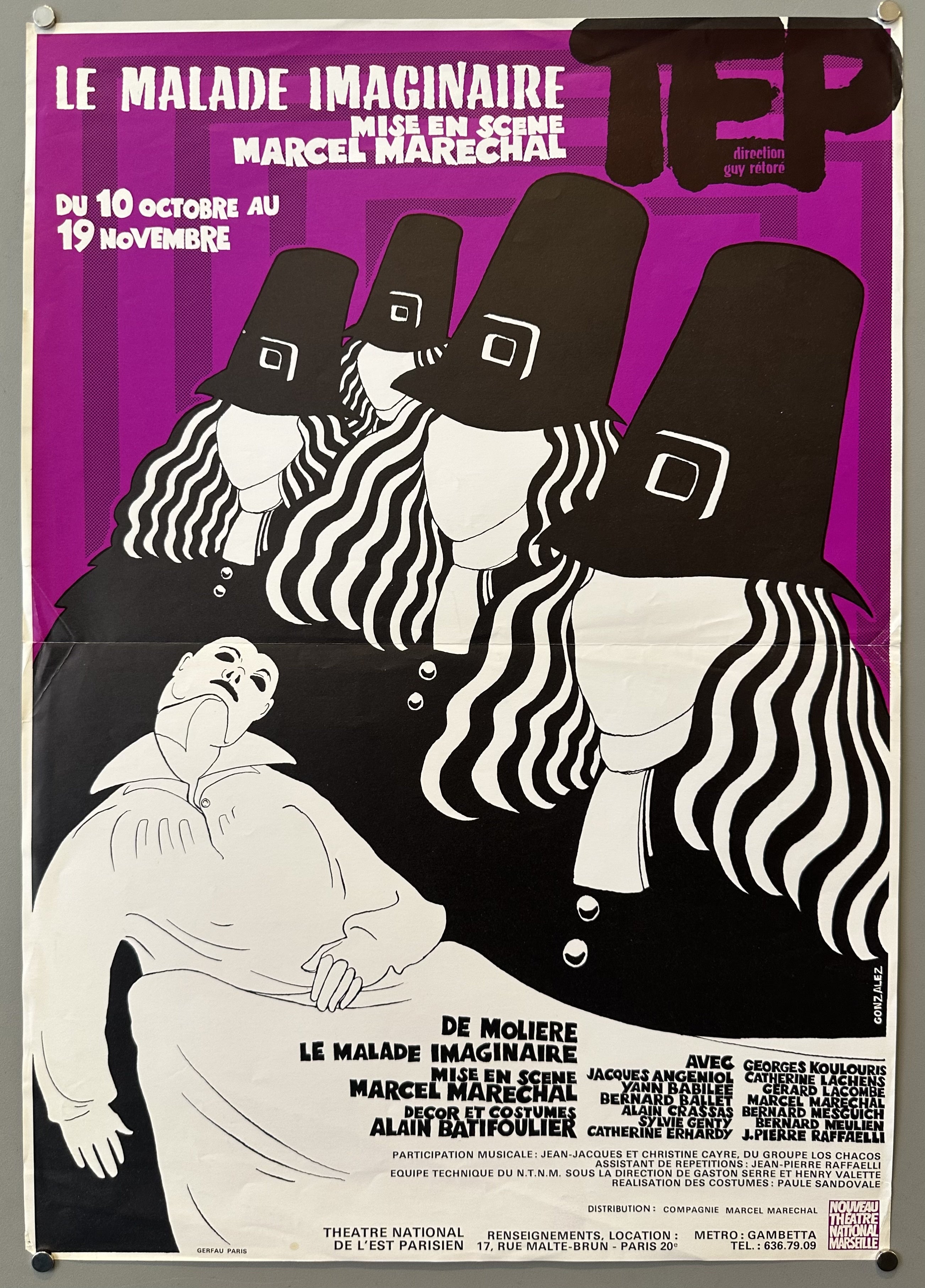 Purple poster with faceless pilgrims lined up holding a white figure in a mask; stylized white and black text along top and bottom of poster.