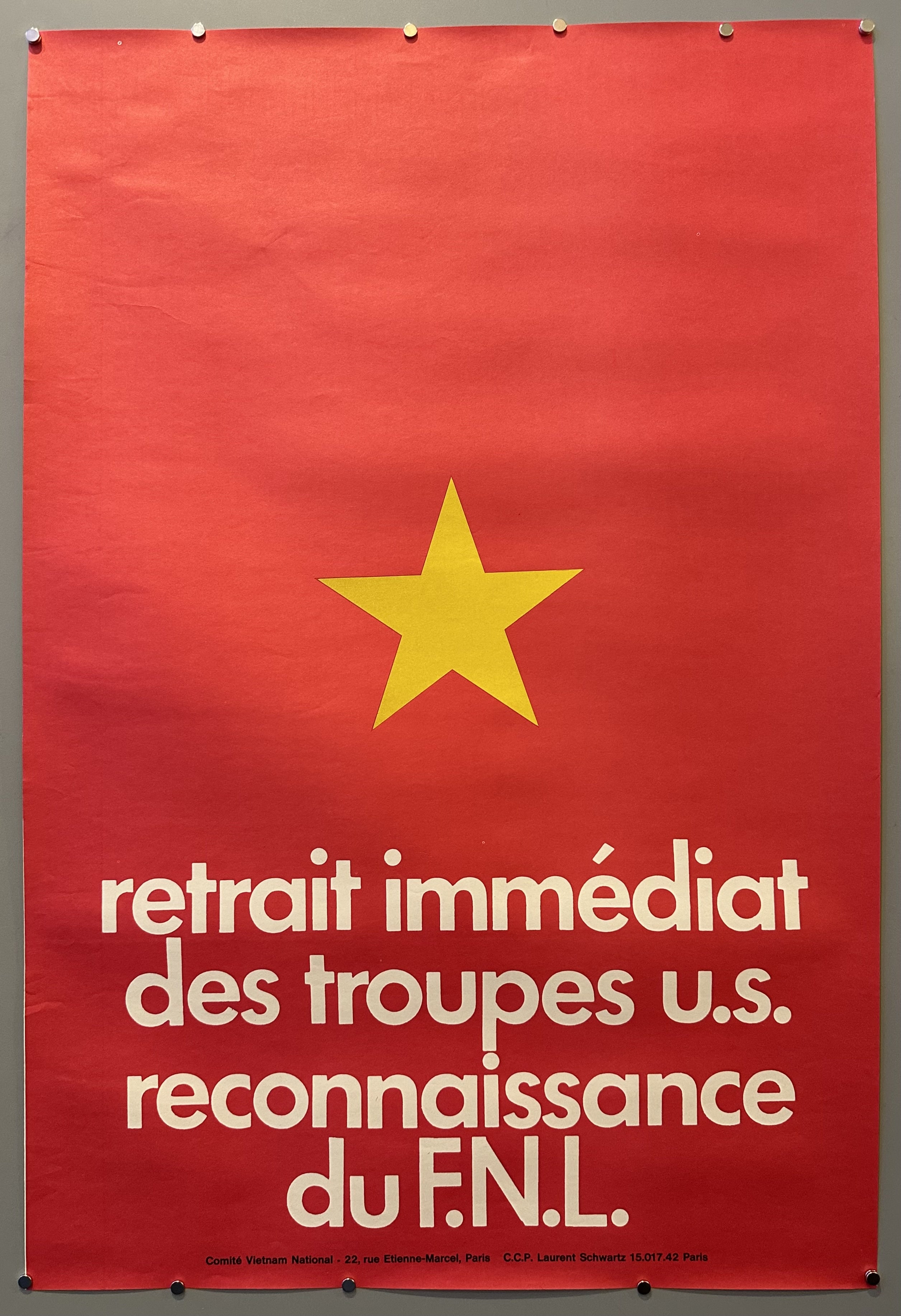 Vietnamese flag serves as the backdrop of this poster with white text below the star.