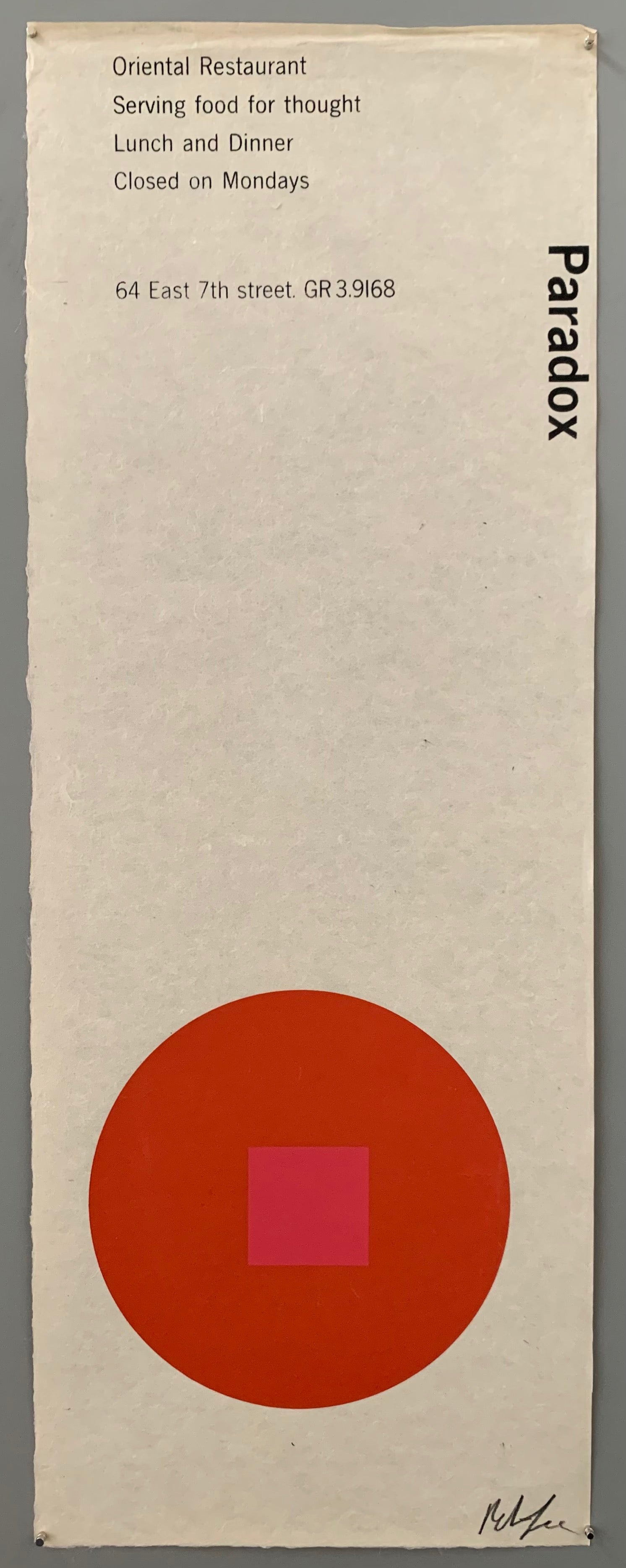 A red circle with a pink square on textured white paper.