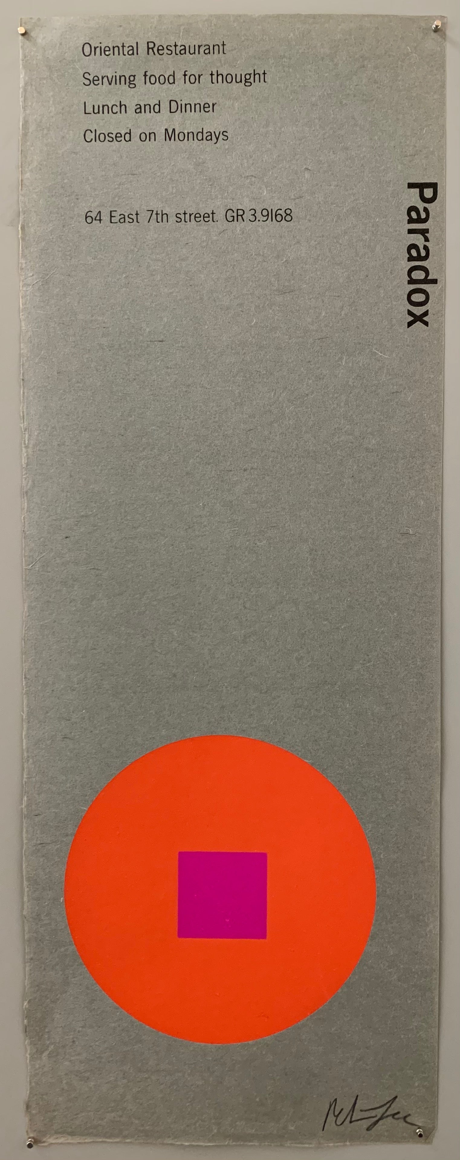 An orange circle with a purple square on textured grey paper.