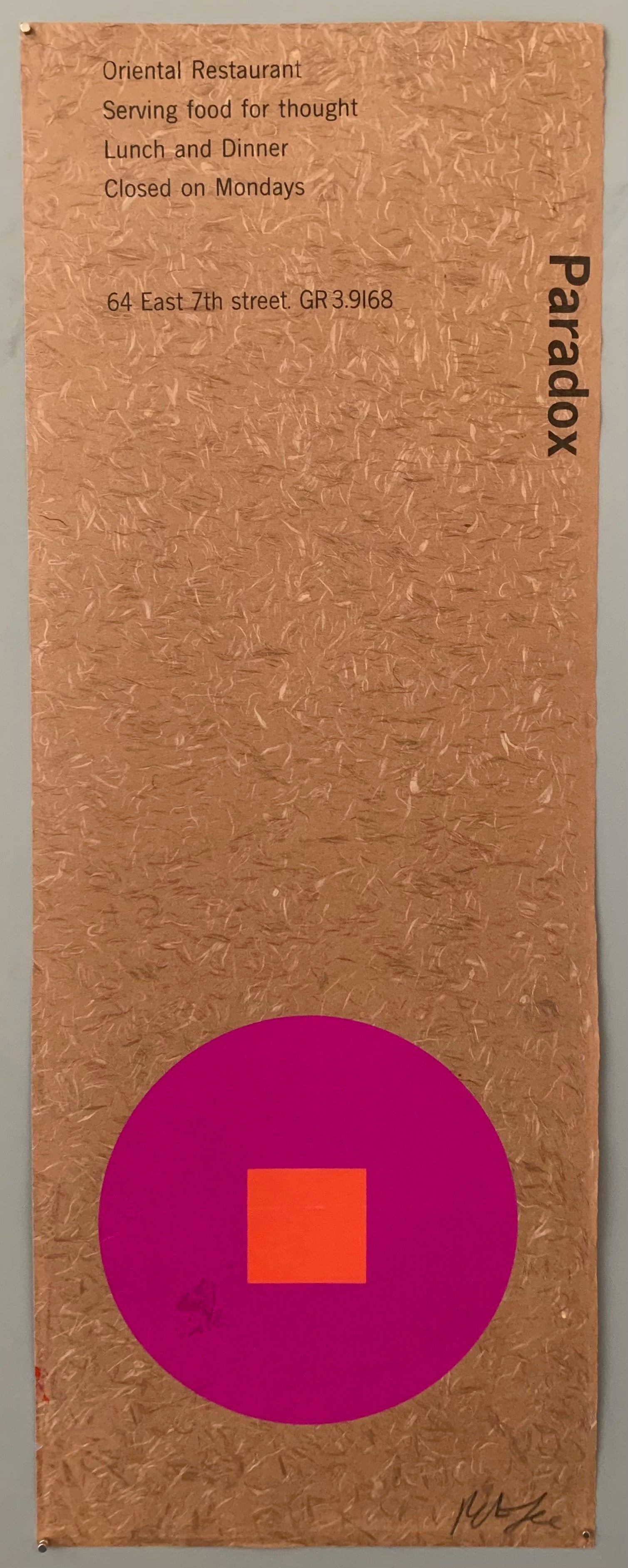 A purple circle with an orange square on a brown patterned paper.