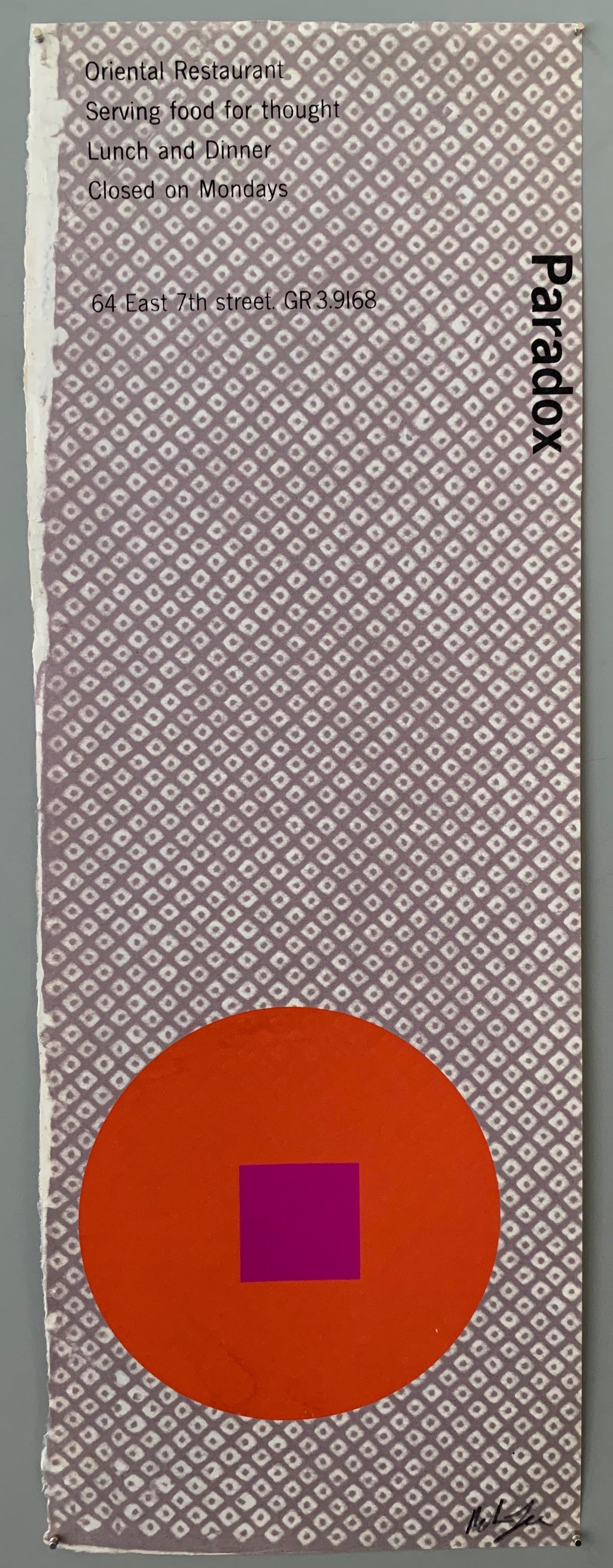 A red circle with an purple square on a white and blue hatch patterned paper.