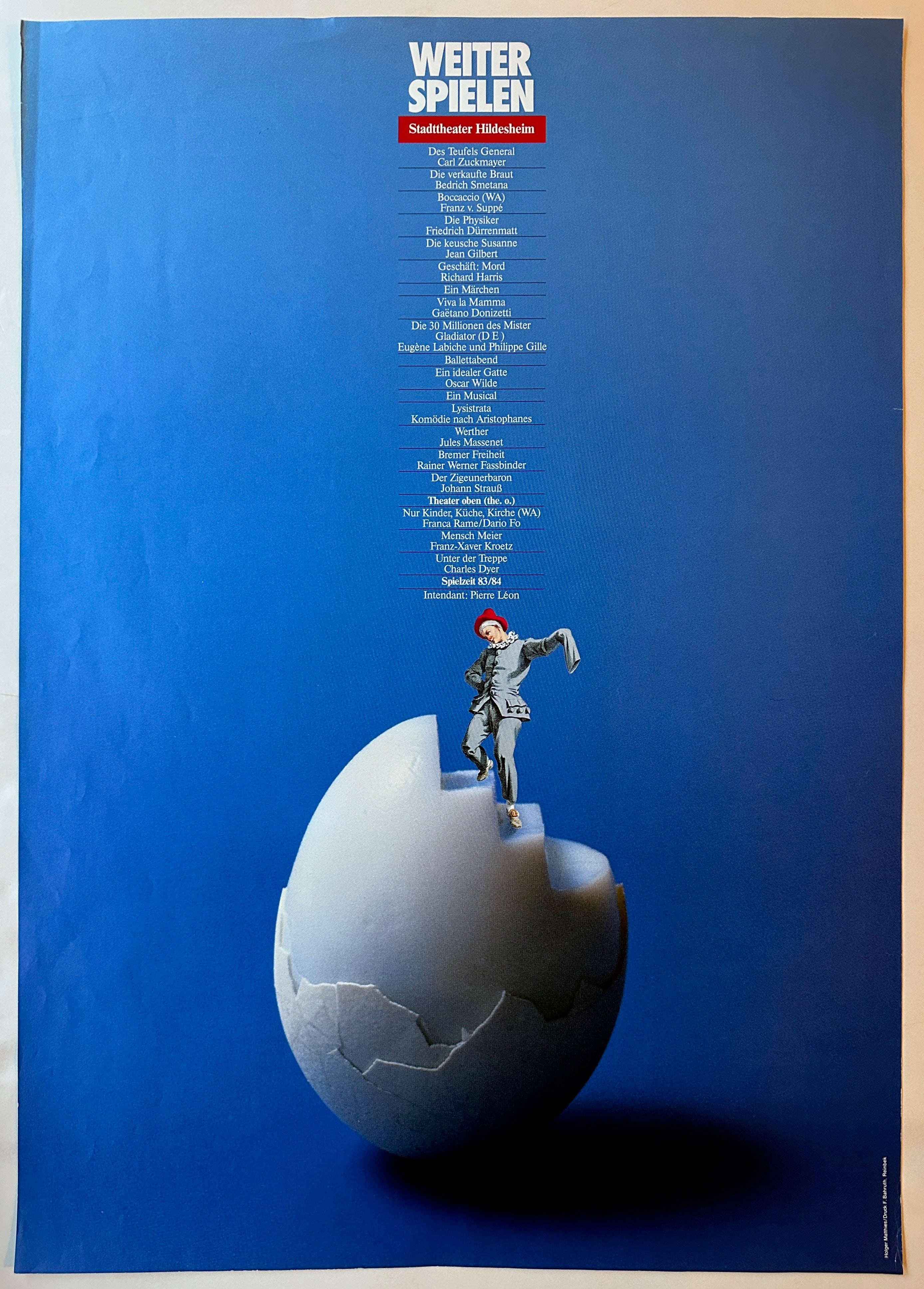 33x23 promotional poster for stadttheater hildesheim with list of running shows on blue background and art of performer climbing stairs in cracked egg