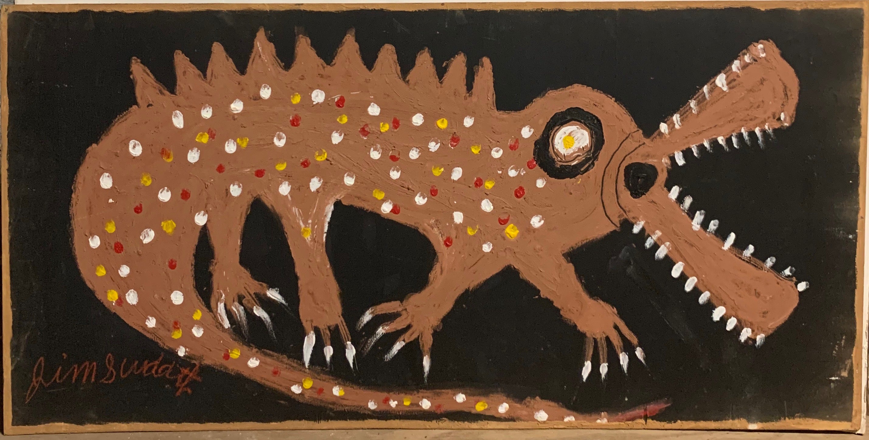 A painting of a polka-dotted alligator.