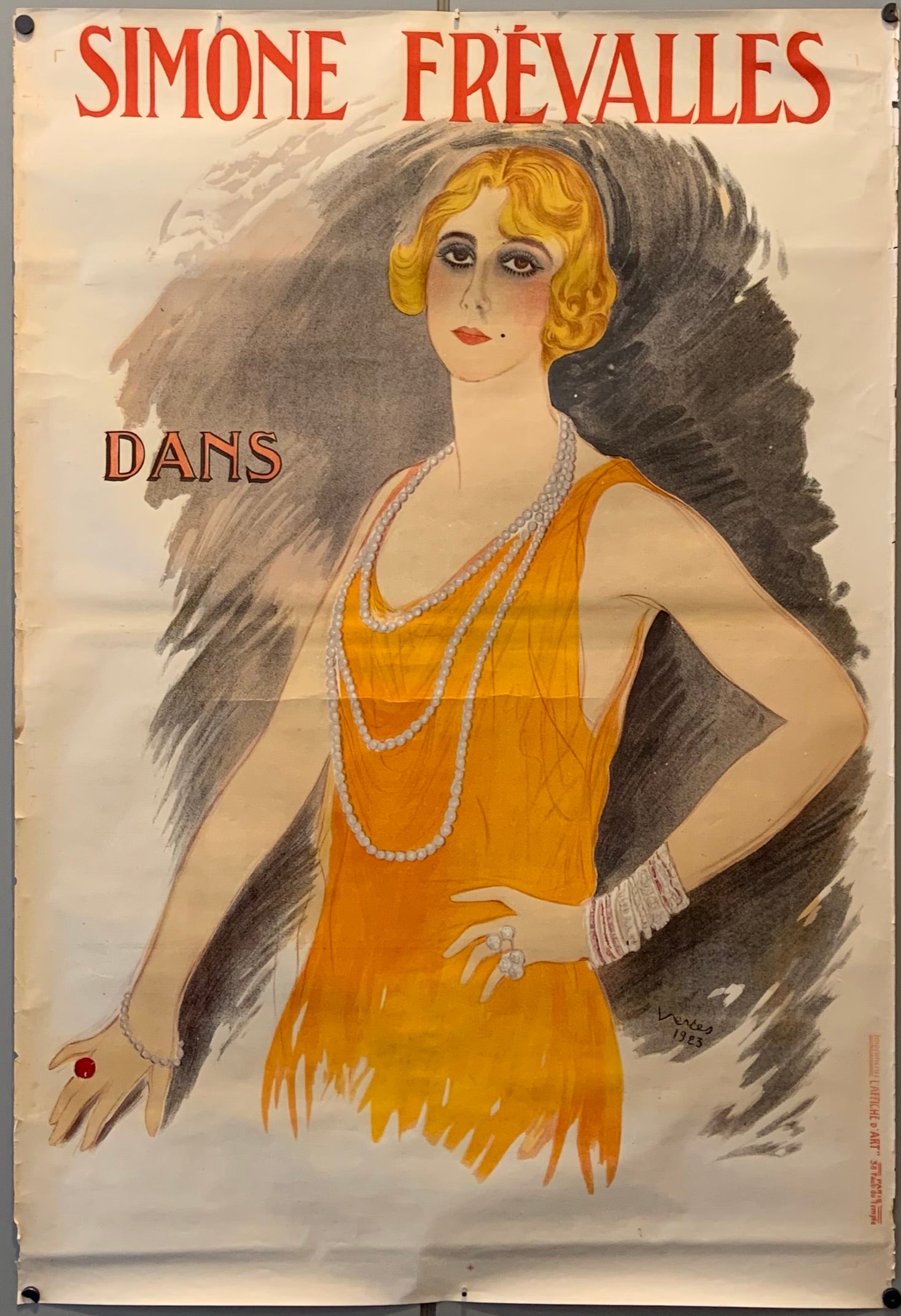 A portrait of Simon Frevalles in an orange dress and pearls.