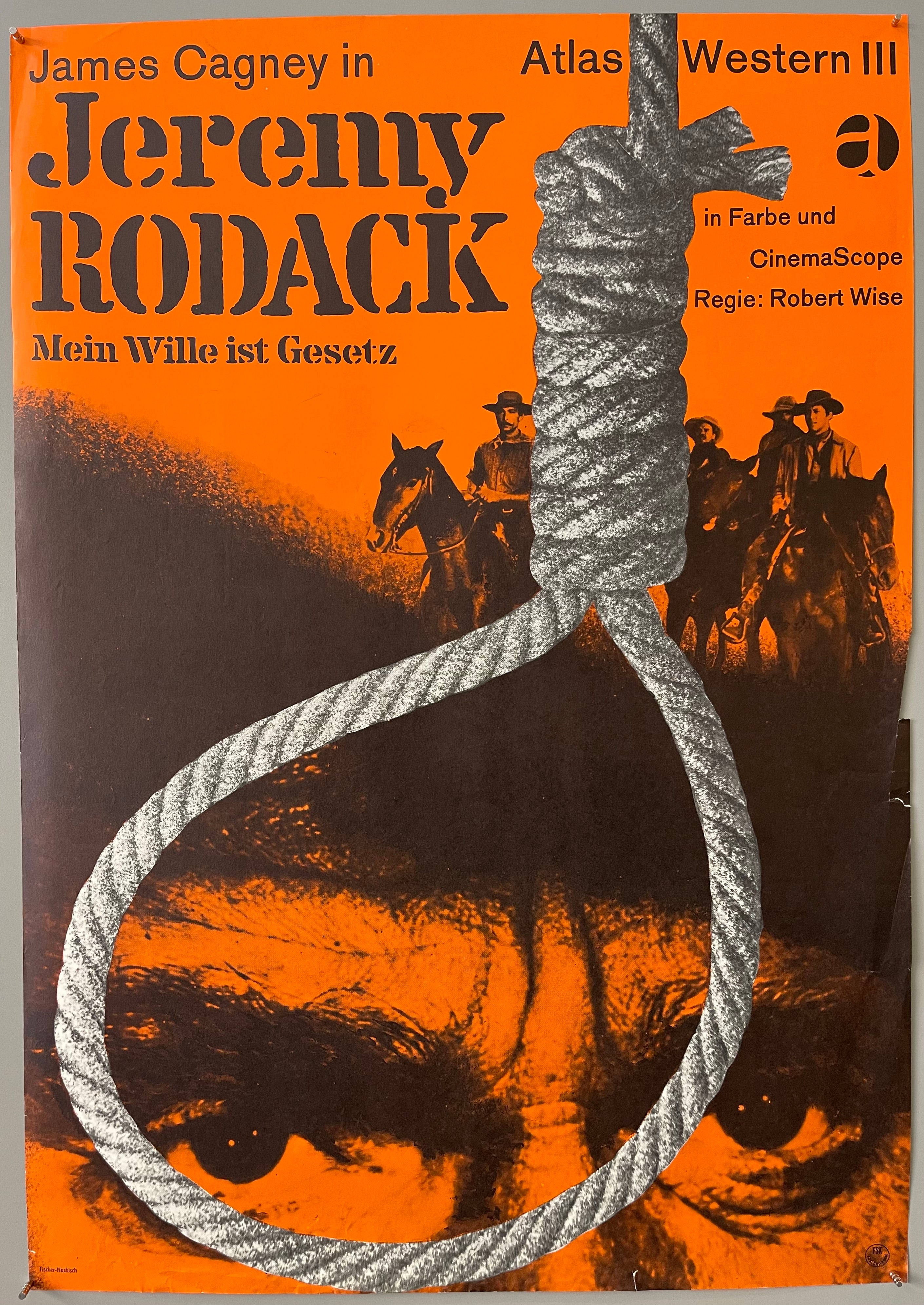 Close-up of a noose outlining the close-up eyes of a man. In the background, four men are on horses.