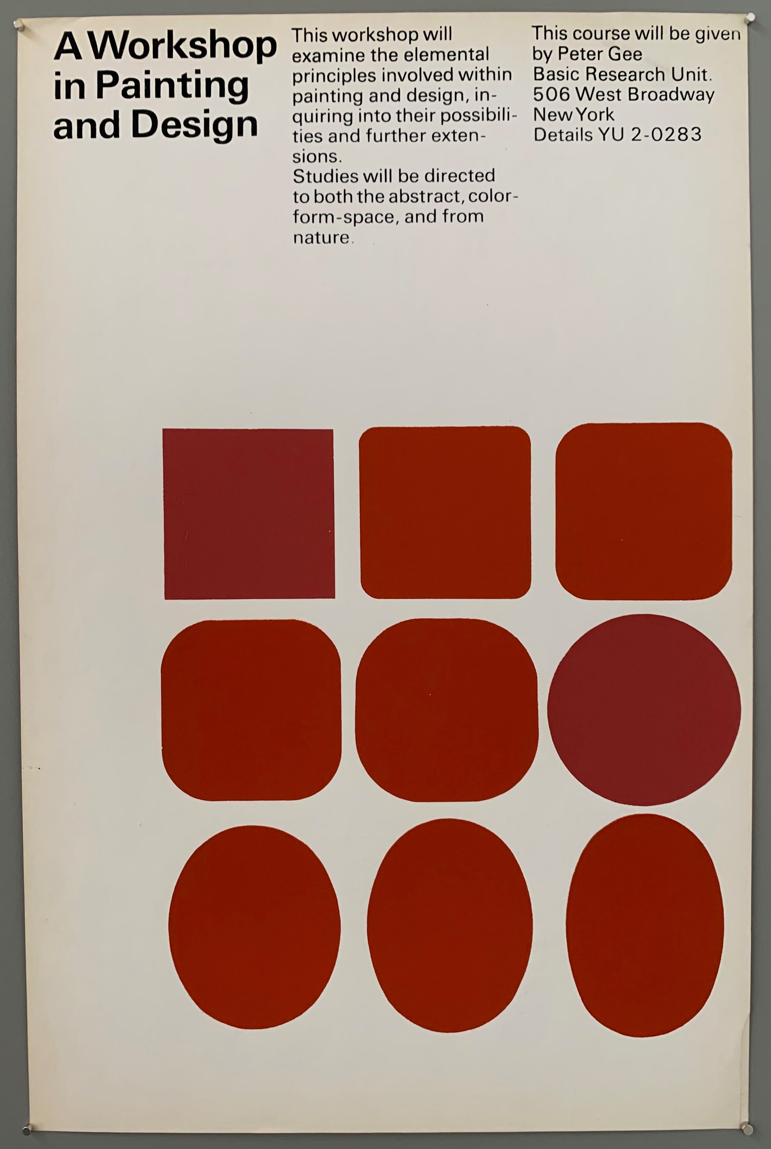 White poster with red squares and ovals