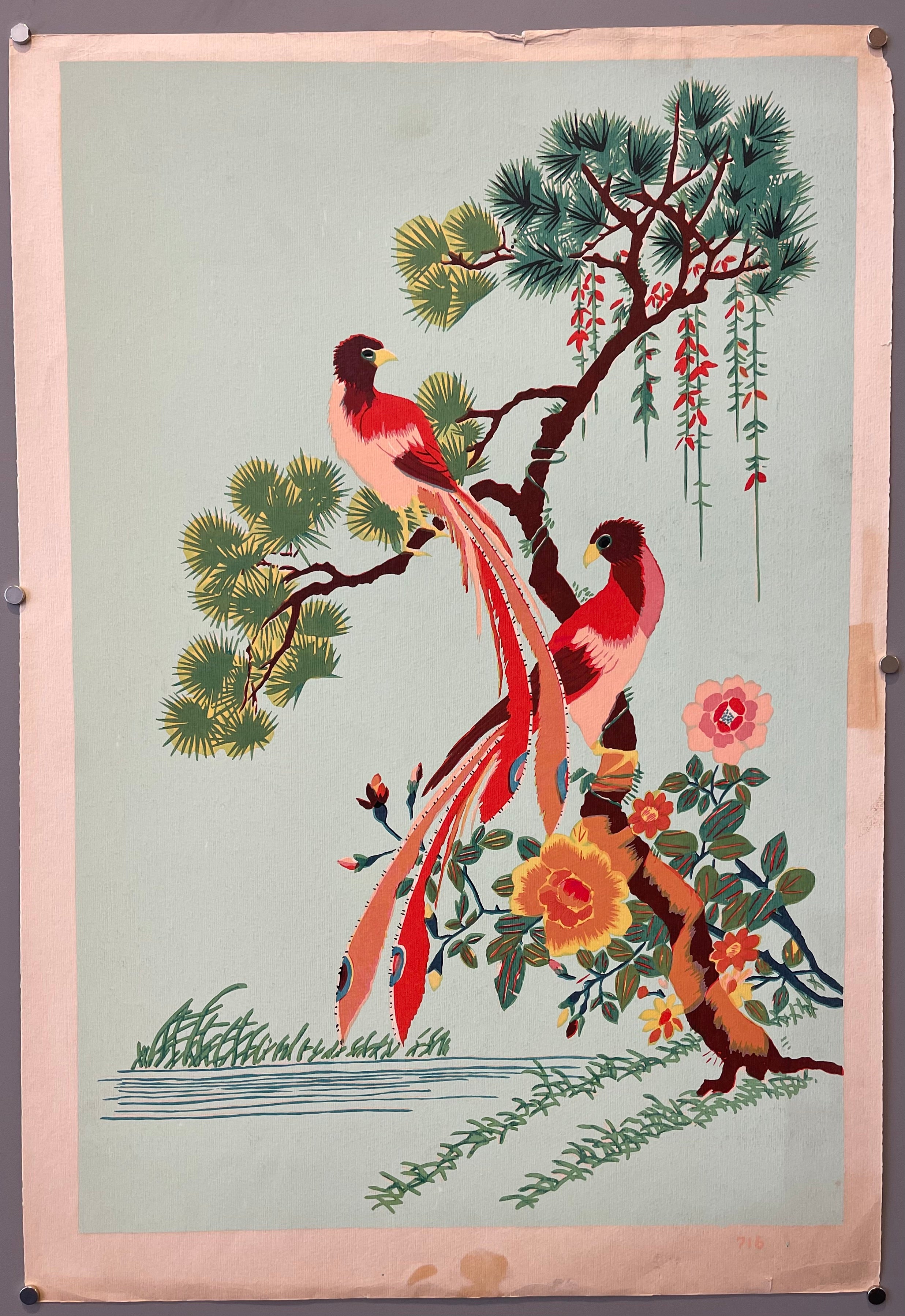 red and peach birds in tree of green and red by water