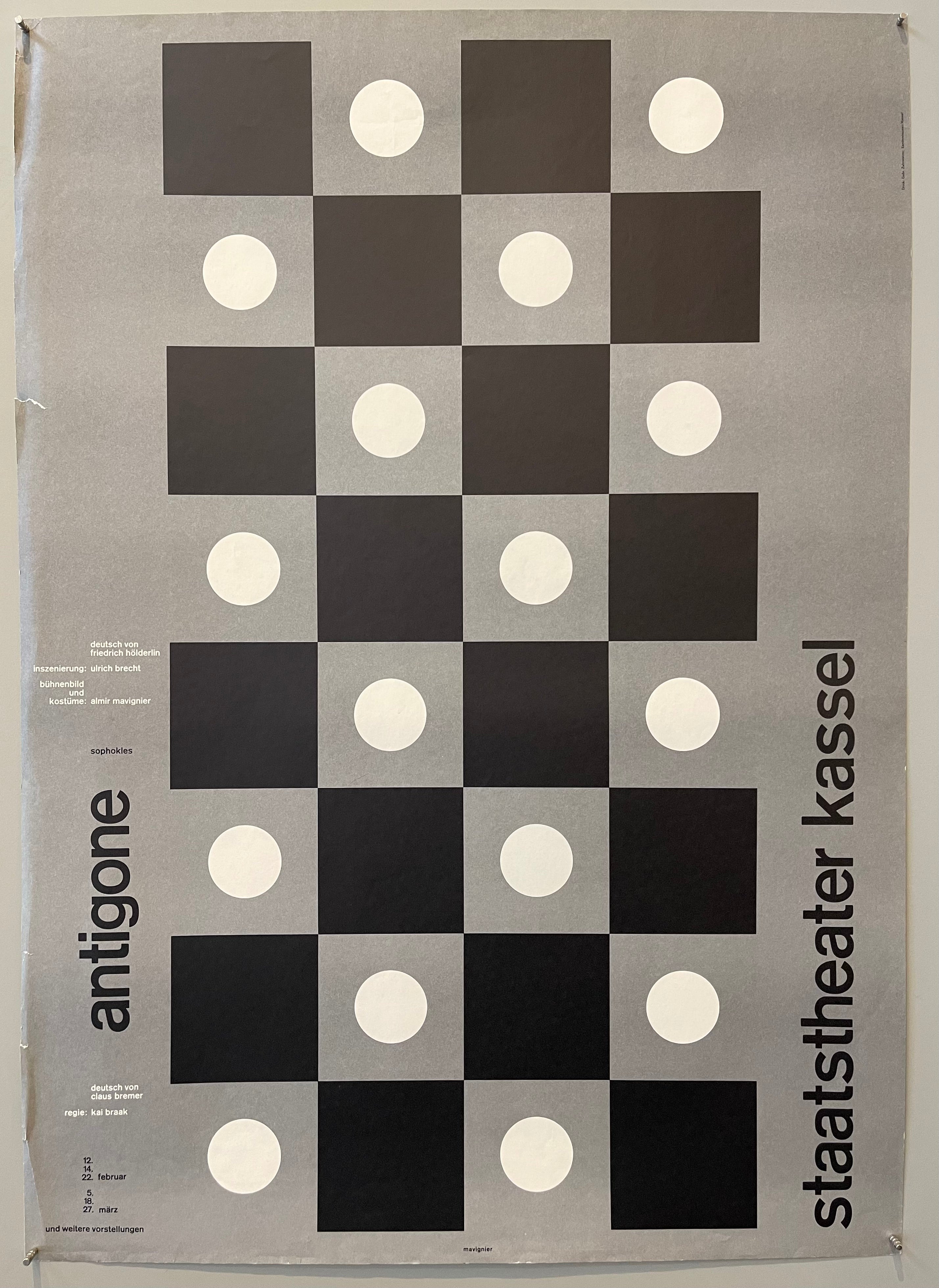 Chess graphic atop a grey background with white circles in-between traditional black square playing board.