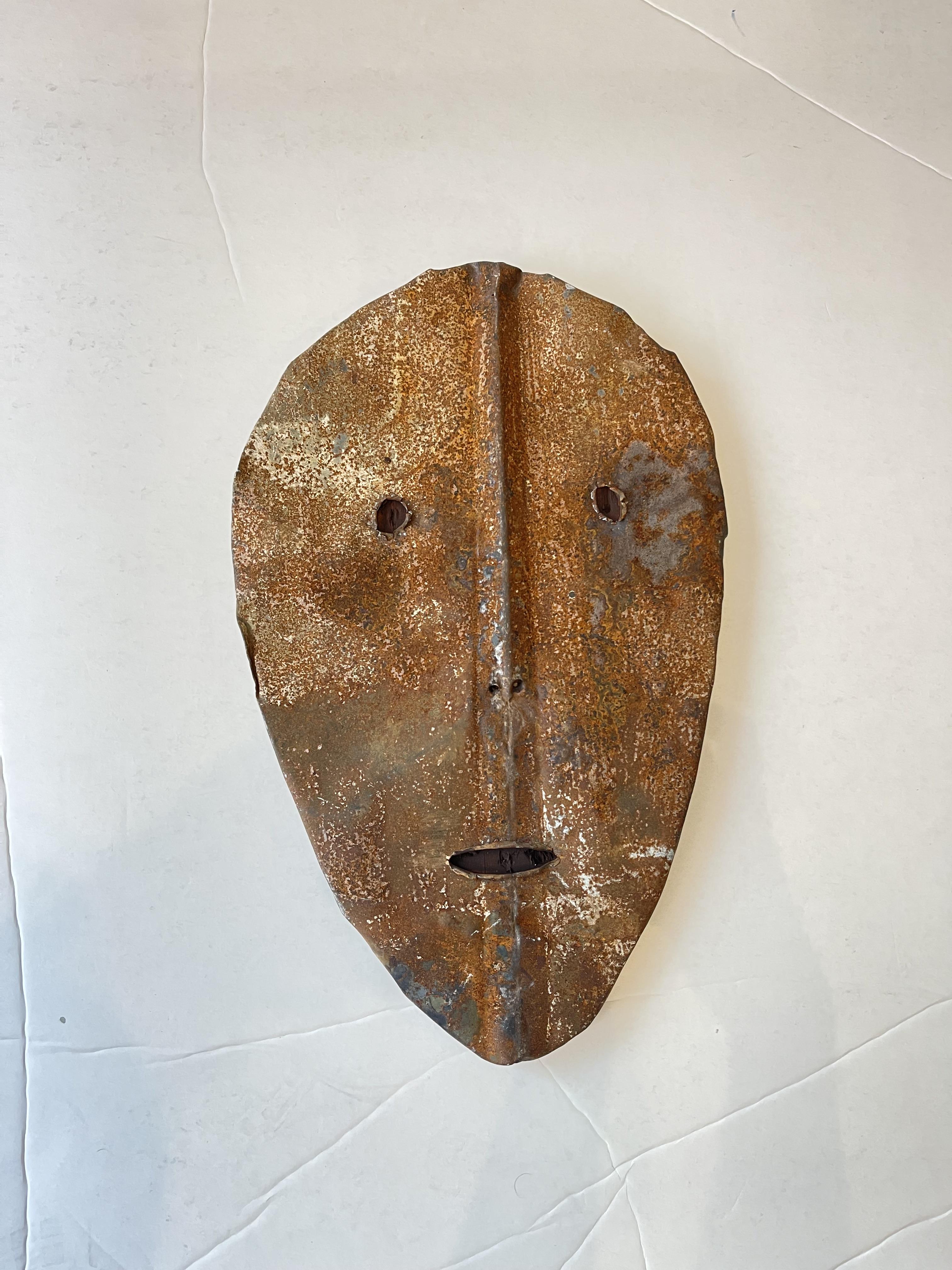 rusted roofing tile made into face