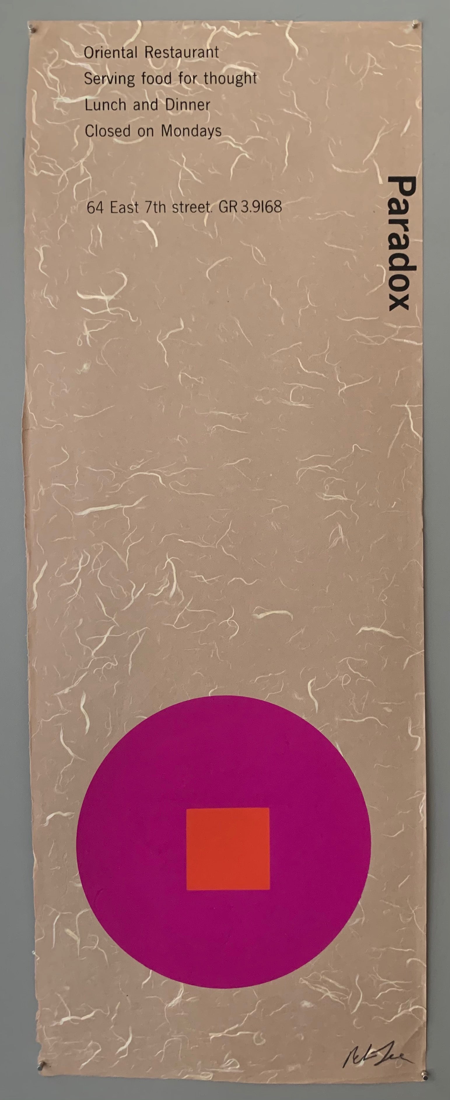A purple circle with a red square on a brown patterned paper.