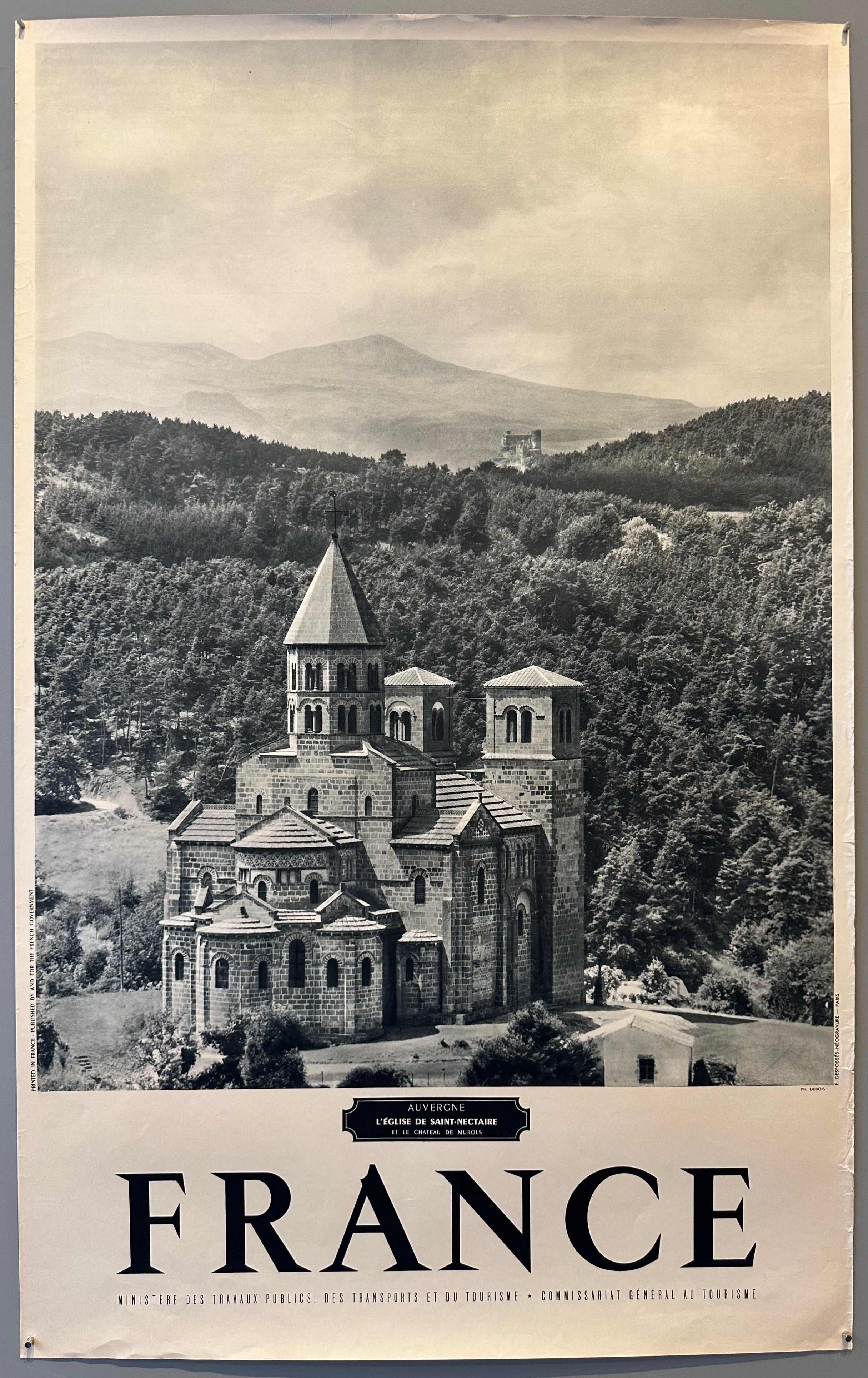 40x25 1950s black and white french travel poster advertising the eglise de saint-nectaire and the chauteau de murols featuring photo with church of saint nectaire in foreground and castle of murols in background