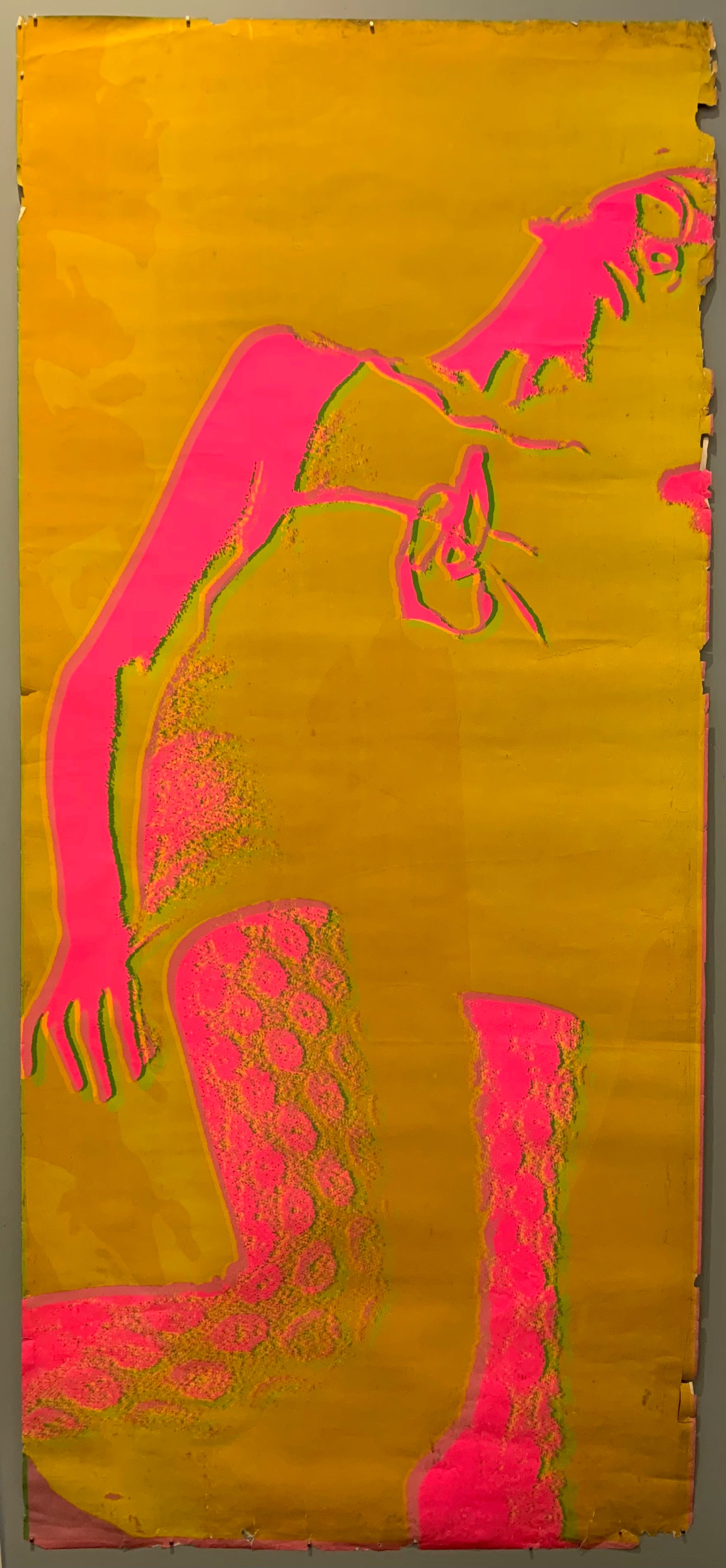 A long vertical shot of a woman in a small dress and fishnets, shot from the ground up.