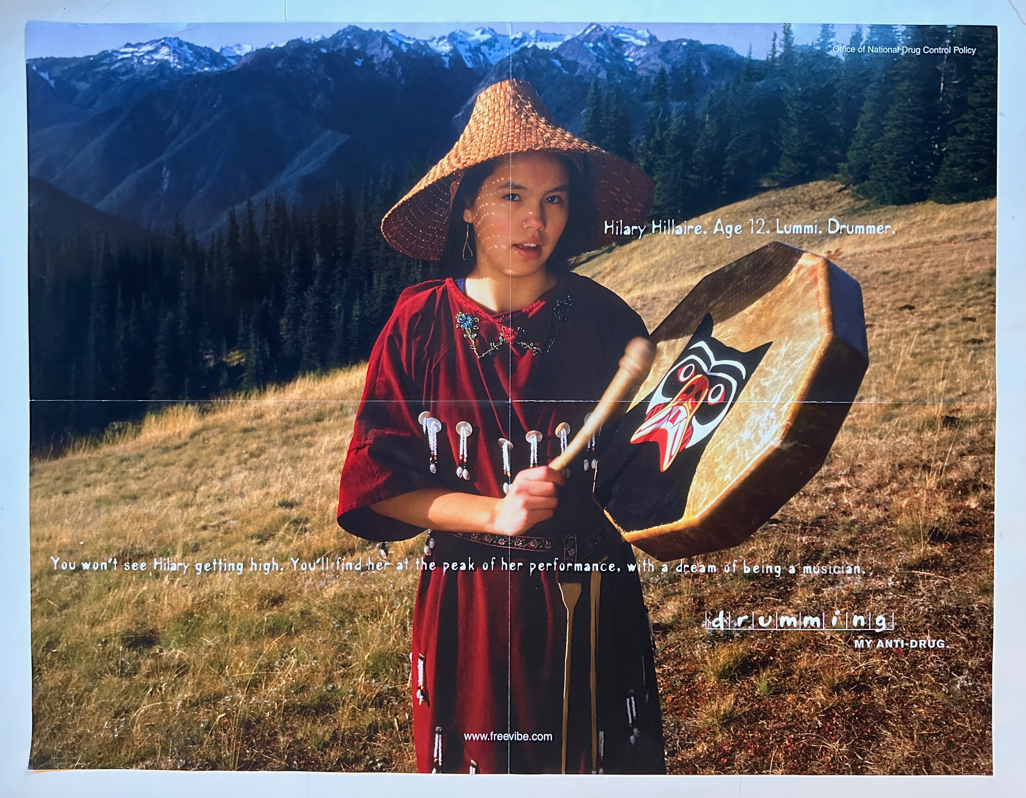 17x22 horizontal poster of adolescent girl holding a drum in the mountains