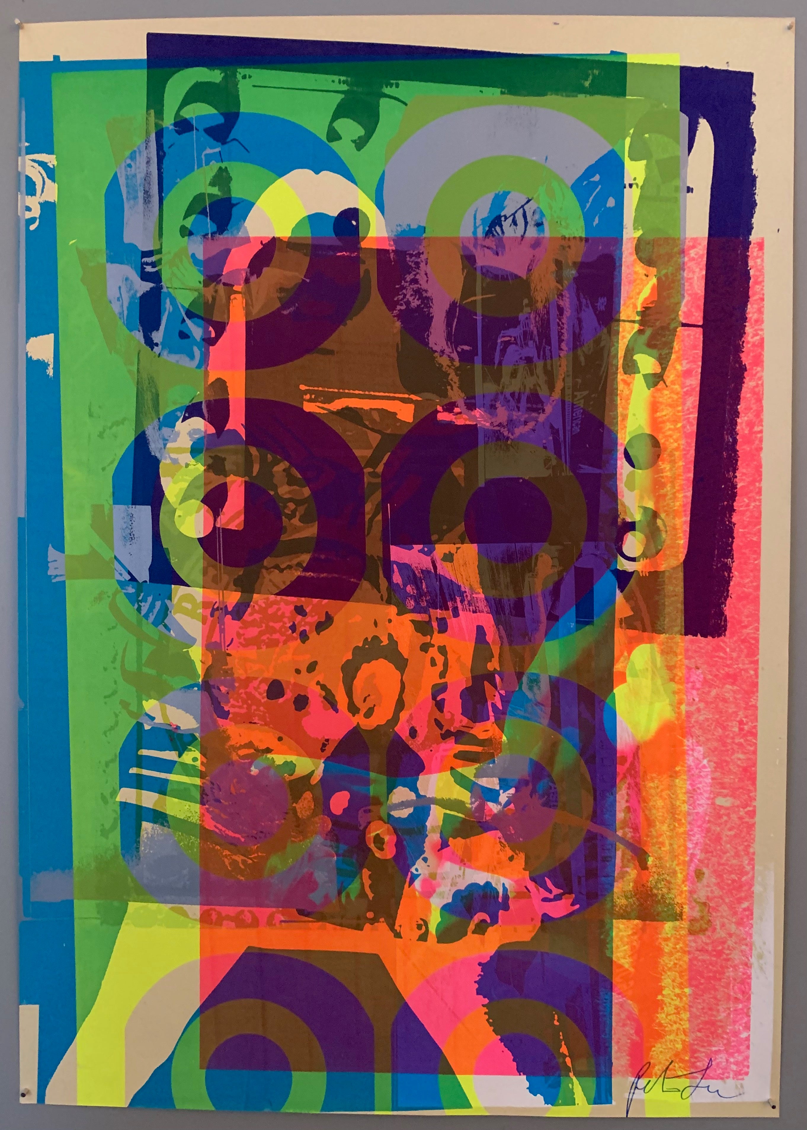 A mix of pop art-style images lay over each other in many neon colors.