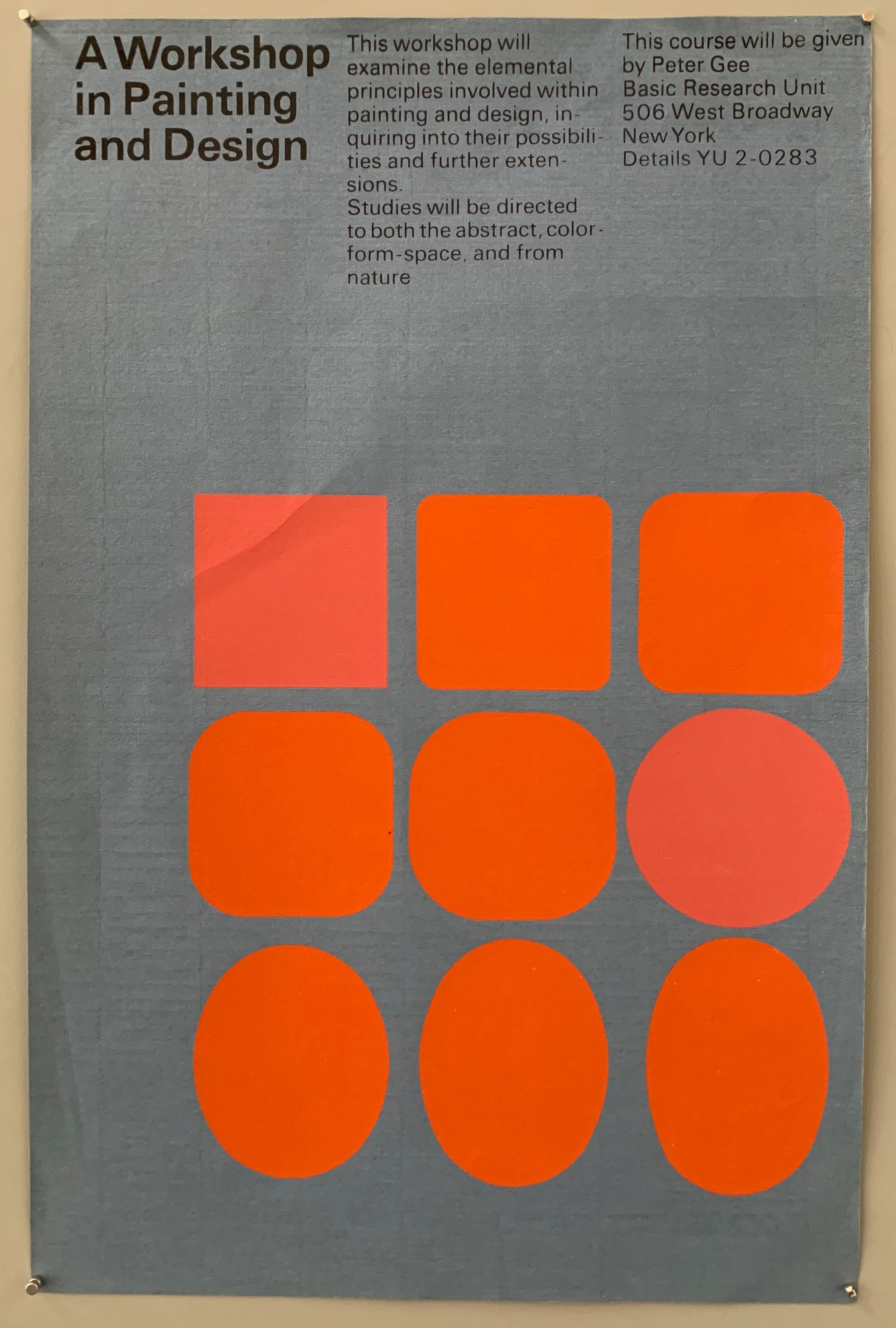 Blue poster with orange squares and ovals