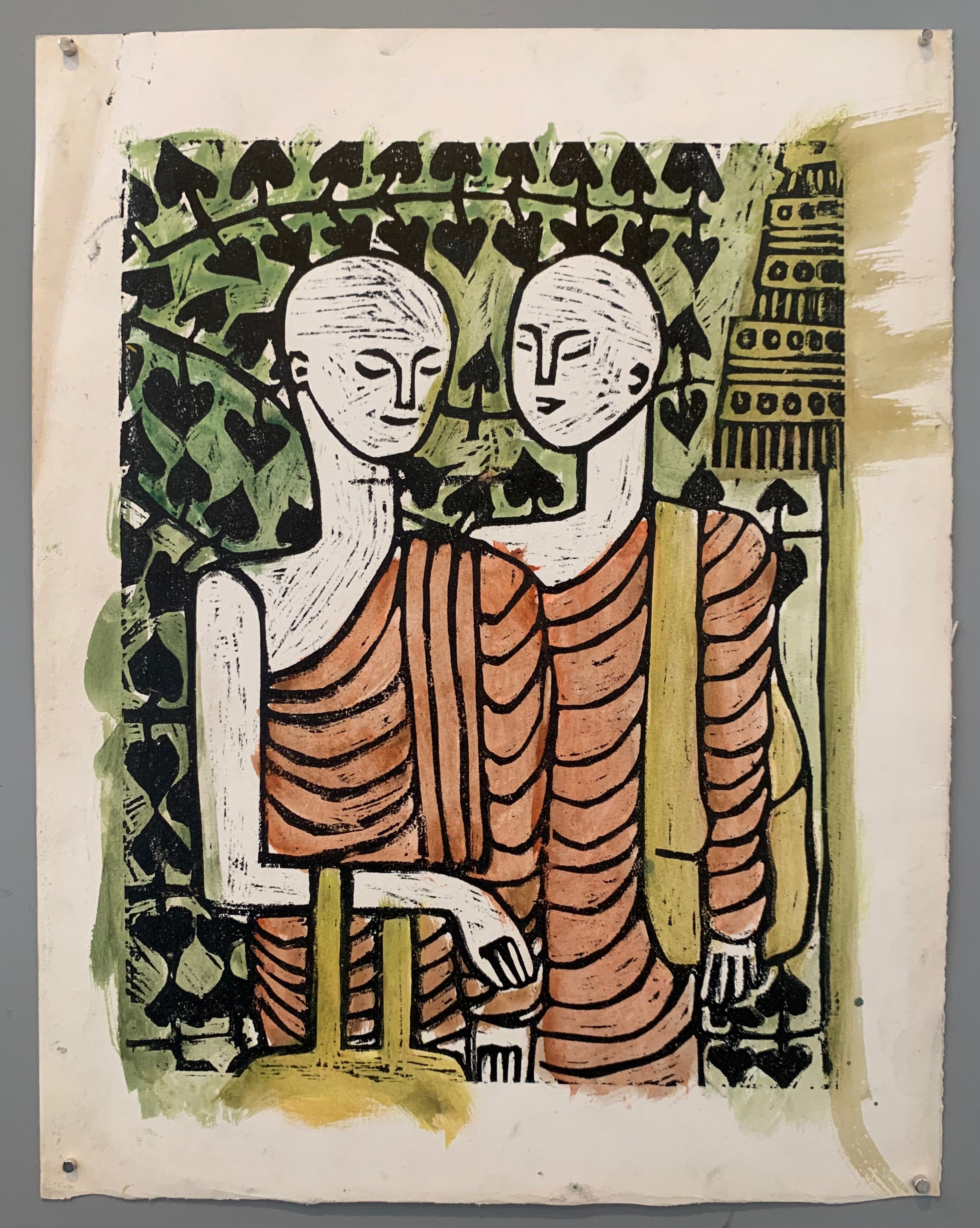 woodblock of two monks in red robes talking in front of a green wall of ivy