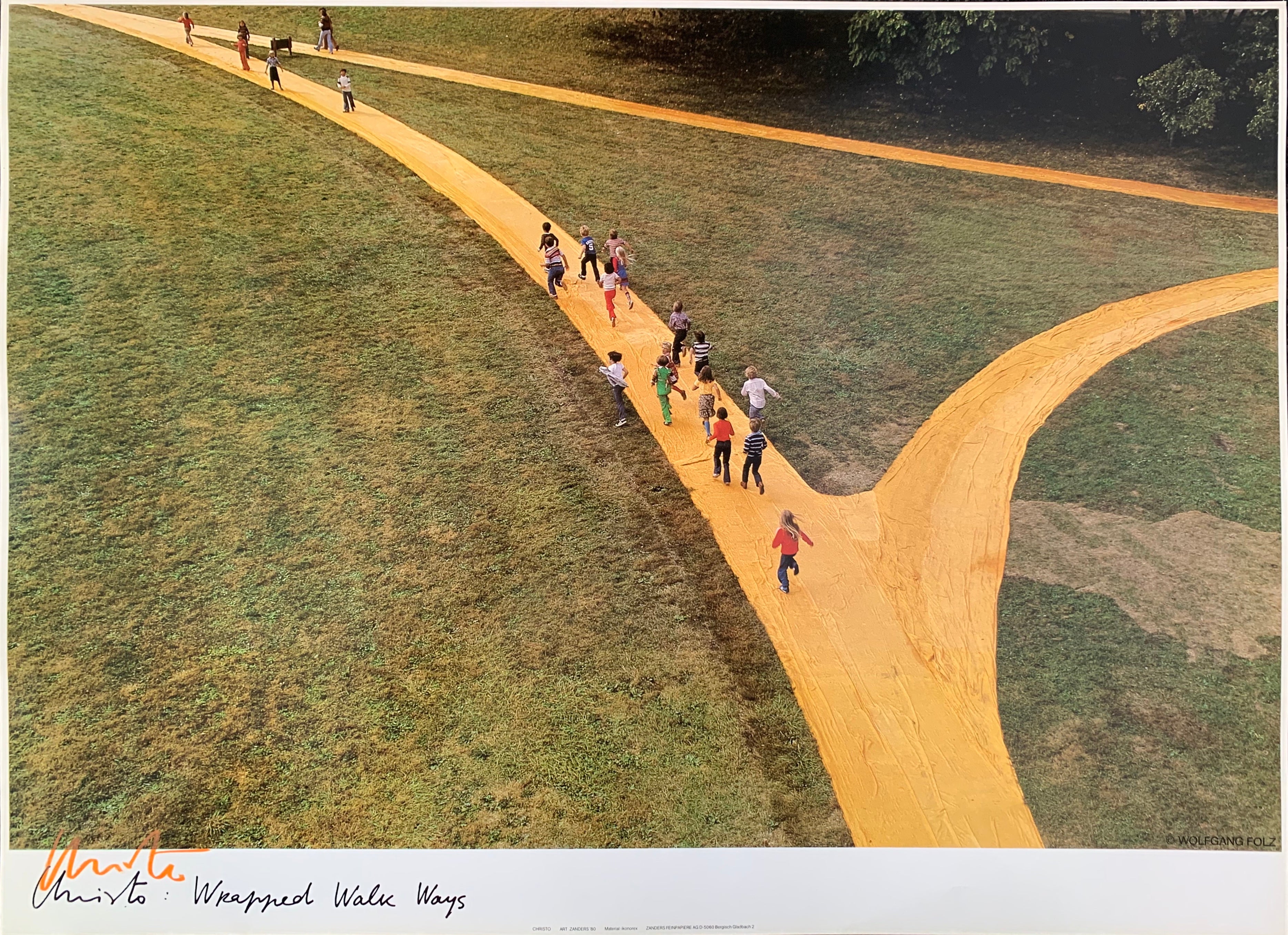 Colored photograph with yellow forking path with children running on it.