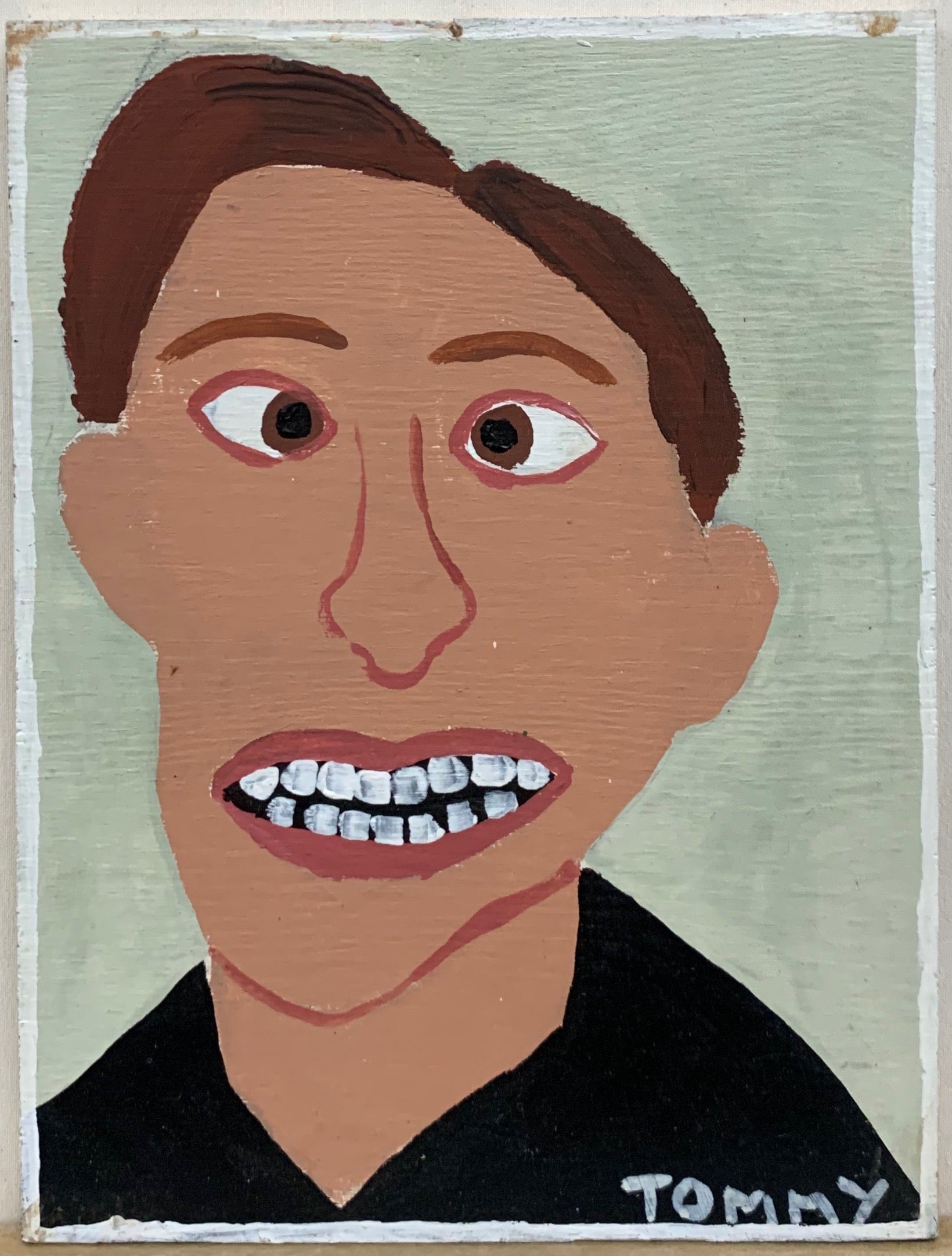Portrait of Adam Zeiner, cross-eyed with a crooked smile.