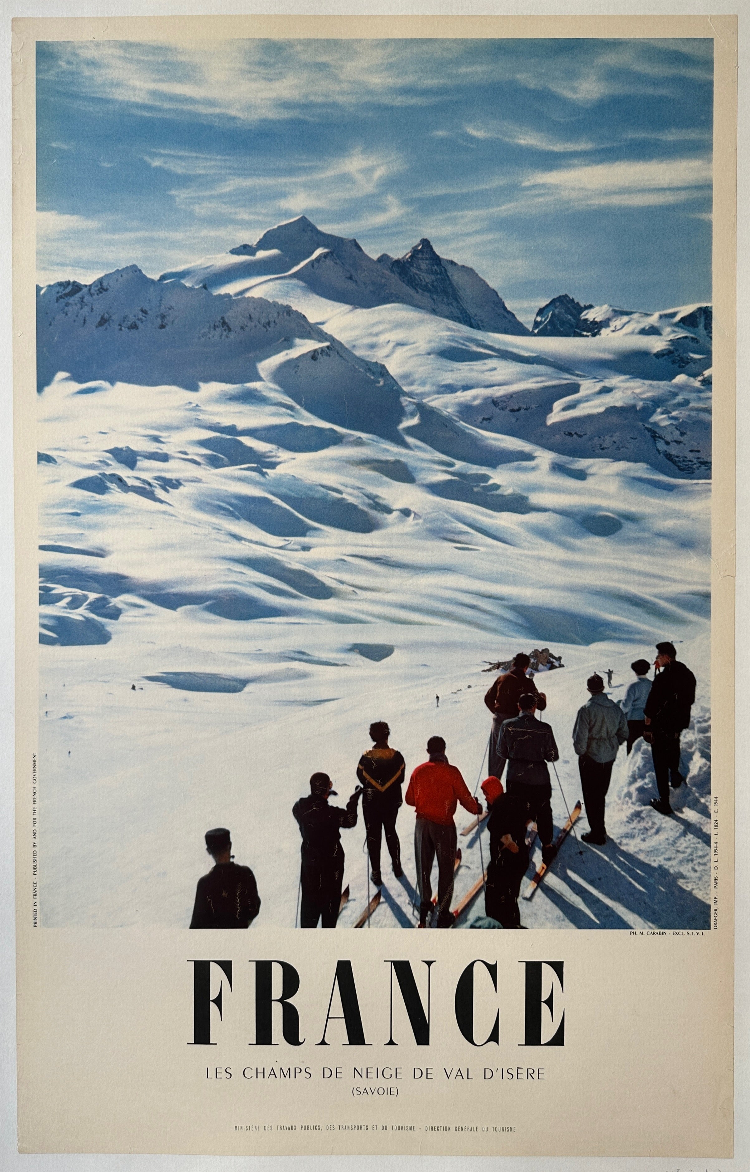 24x39 linen backed French travel poster featuring a photo of a snowy mountain range and people skiing below