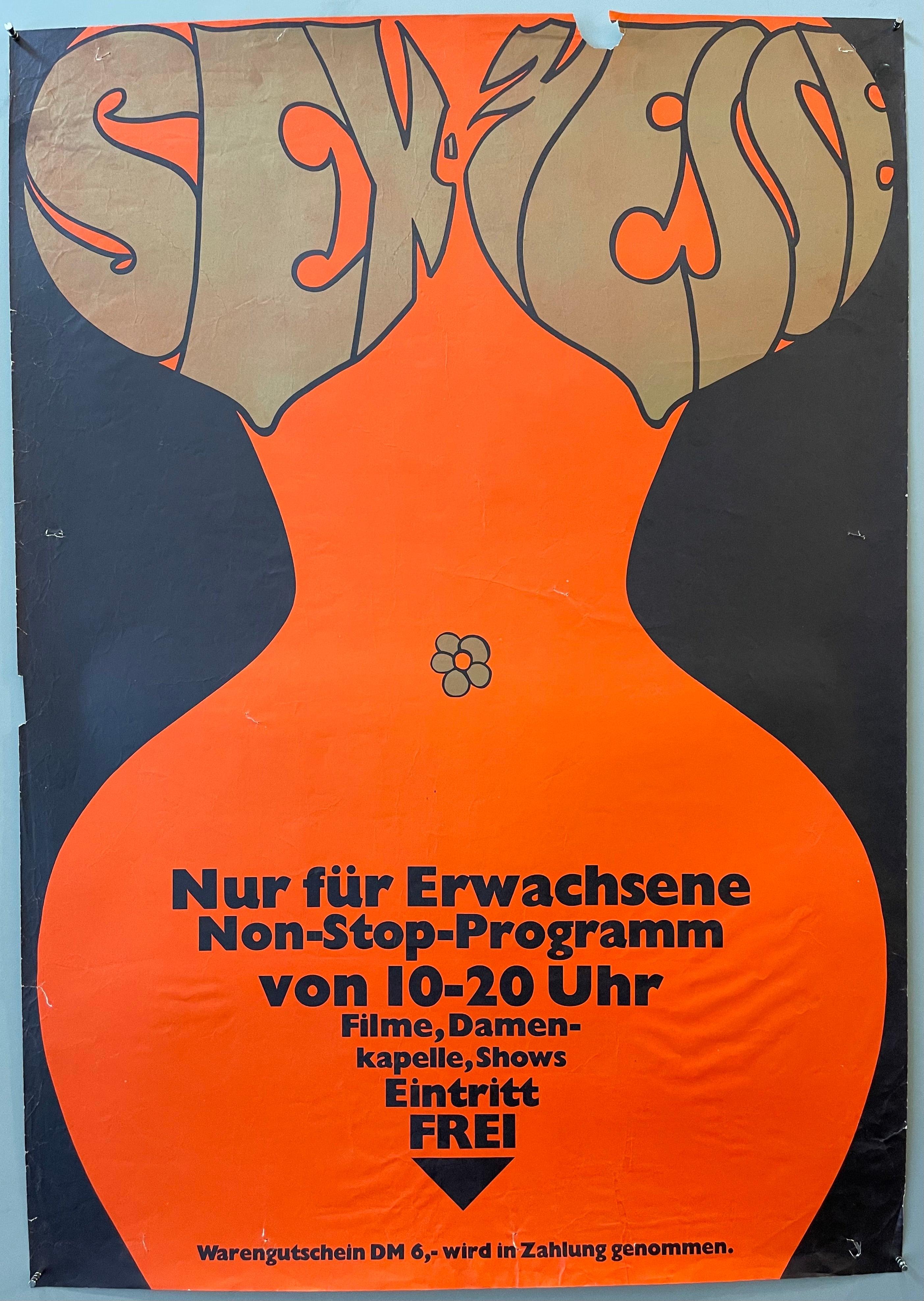 Outline of a woman's breasts, torso, and hips in orange against a black background