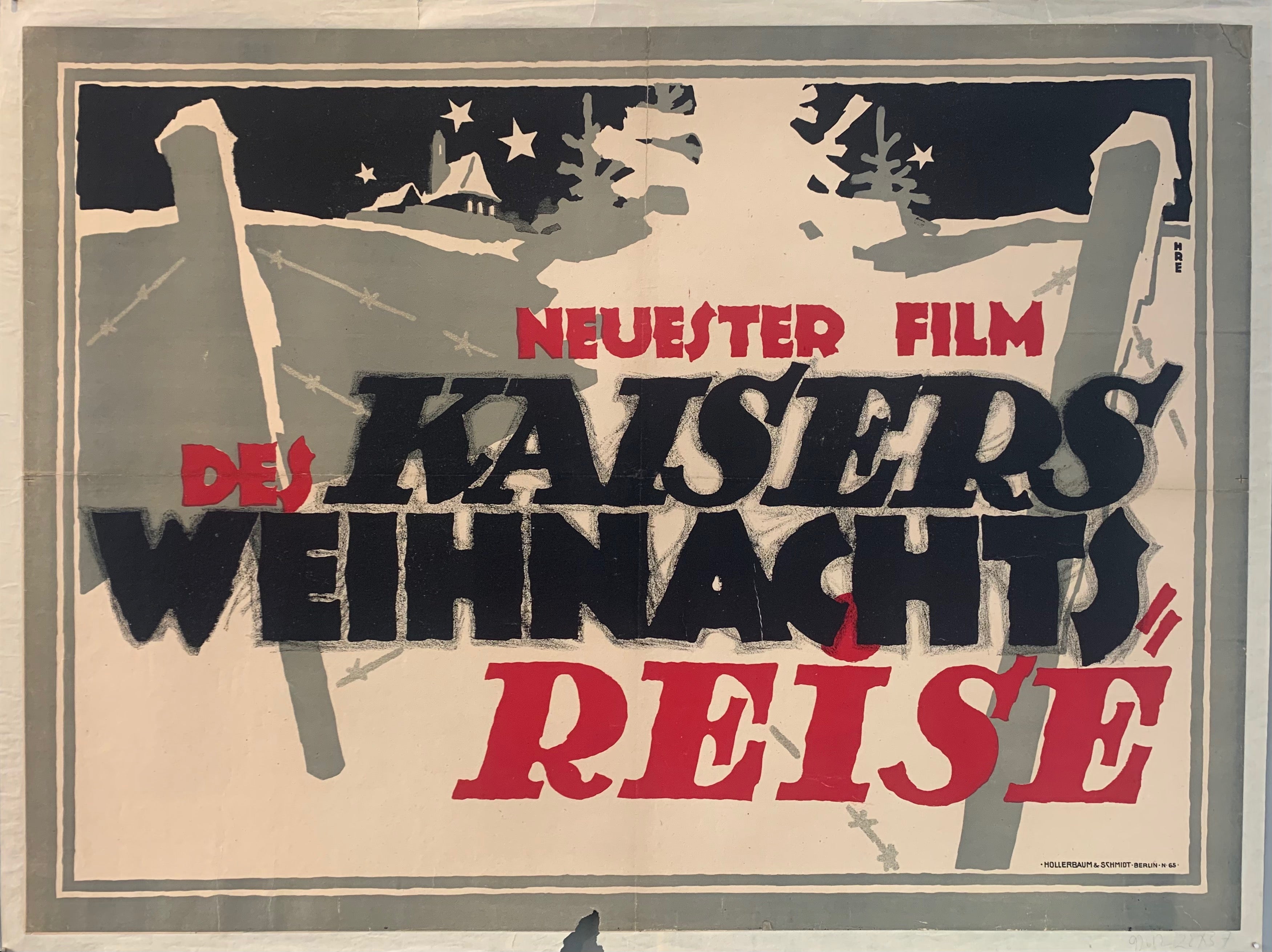 Poster shows a winter scene at the battlefield field. In the background, a church with stars overhead; in the foreground, fence posts with barbed wire strung between them and evergreen trees. Text advertises Neuster Film "The Emperor's Christmas Journey."