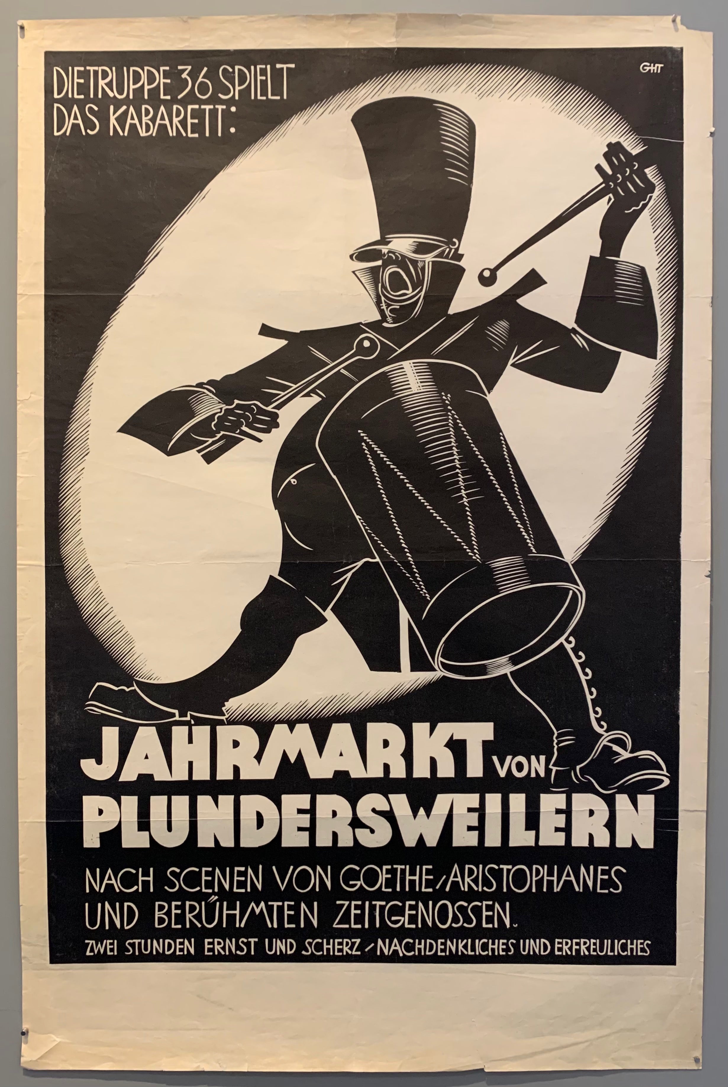 Dramatic black and white poster of a man playing a drum.