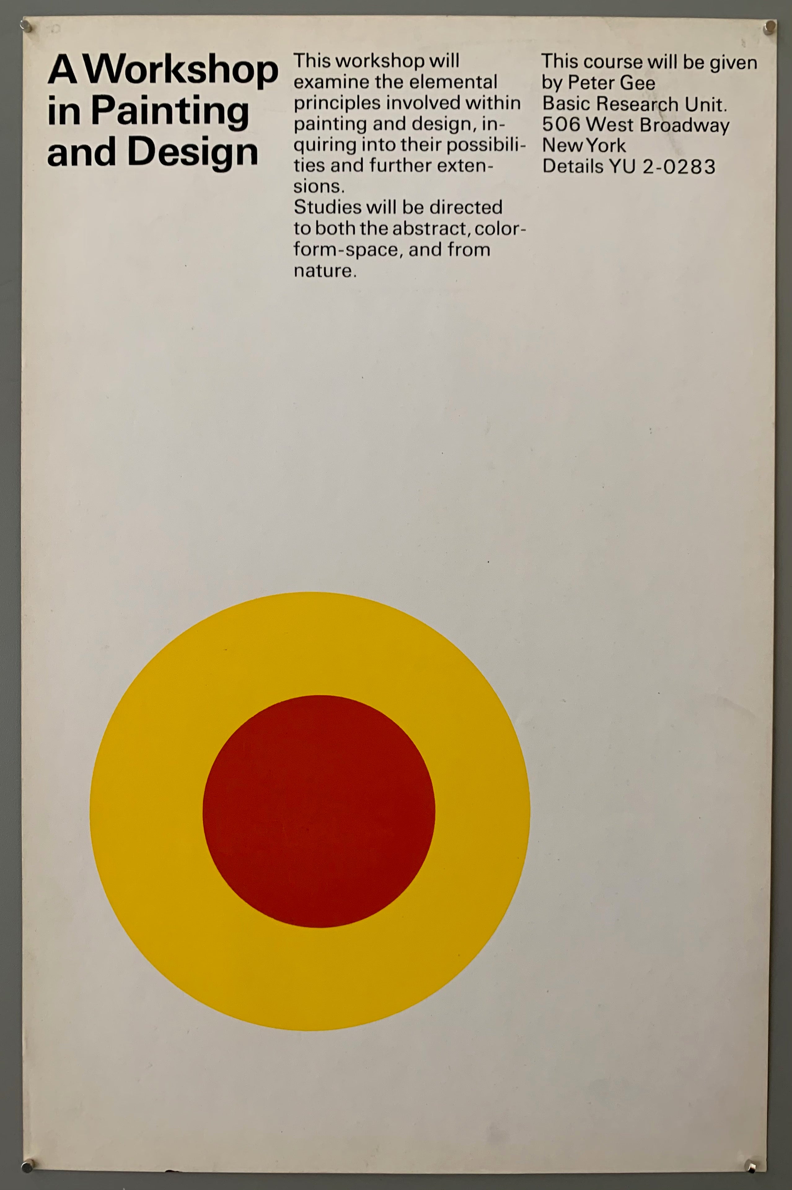 White poster with a yellow and red target