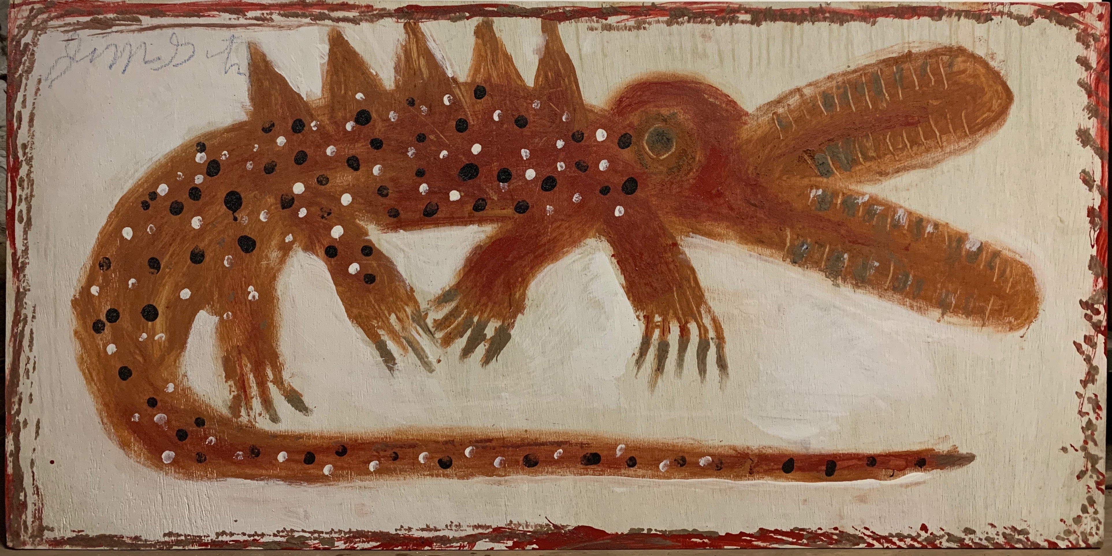 A Jimmie Lee Sudduth painting of a spotted alligator.