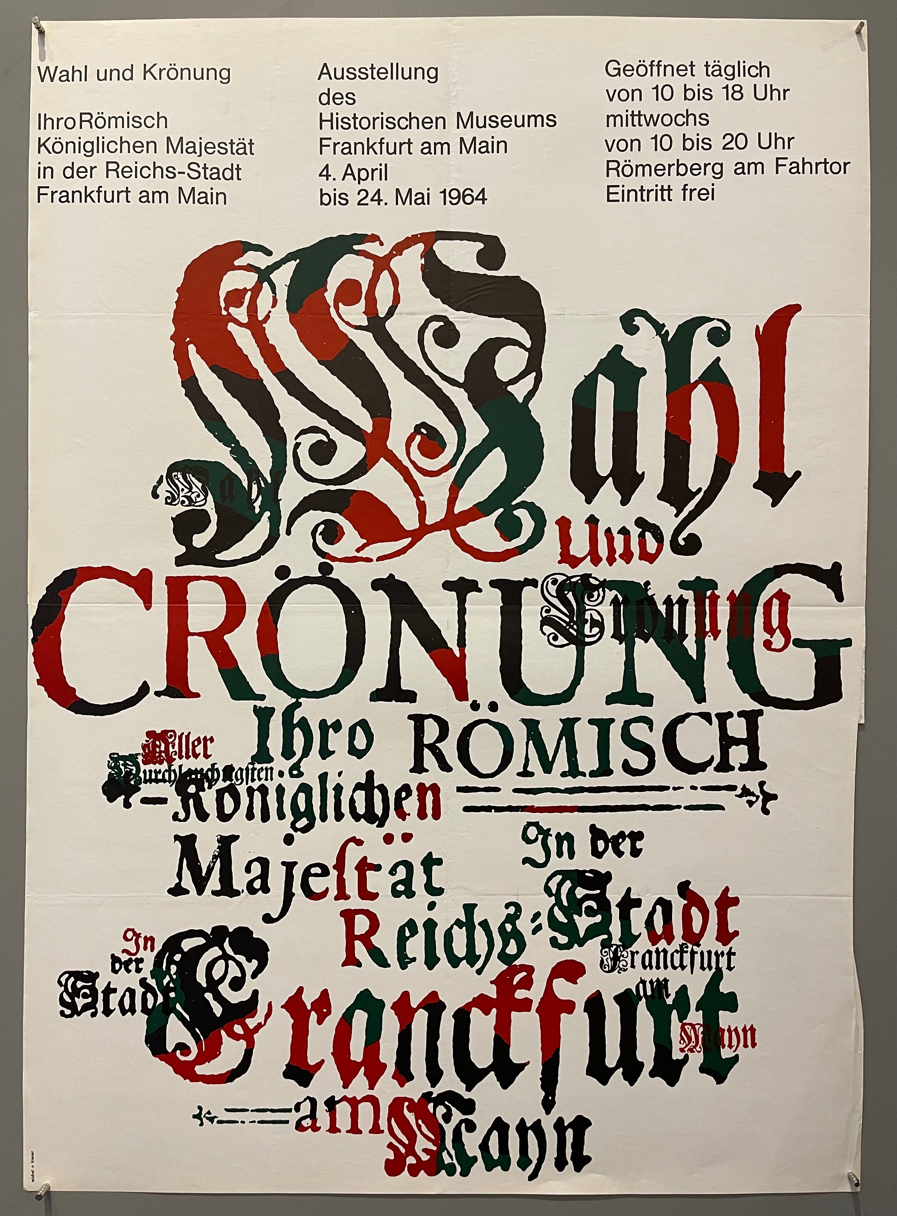 Medieval green, black, and red lettering over white background