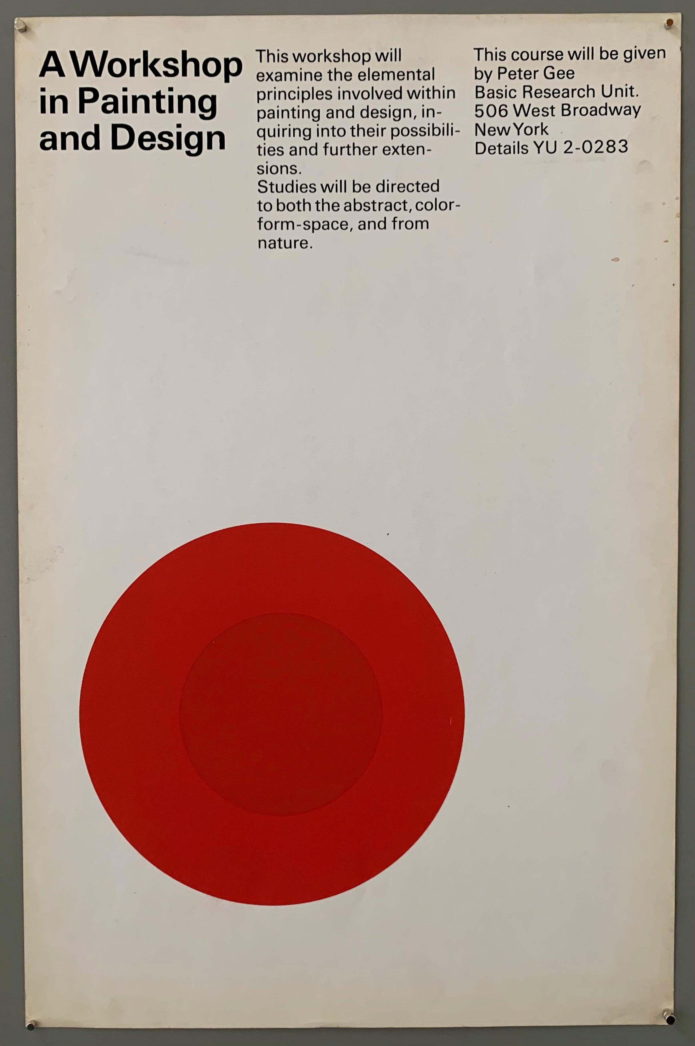 White poster with a red target