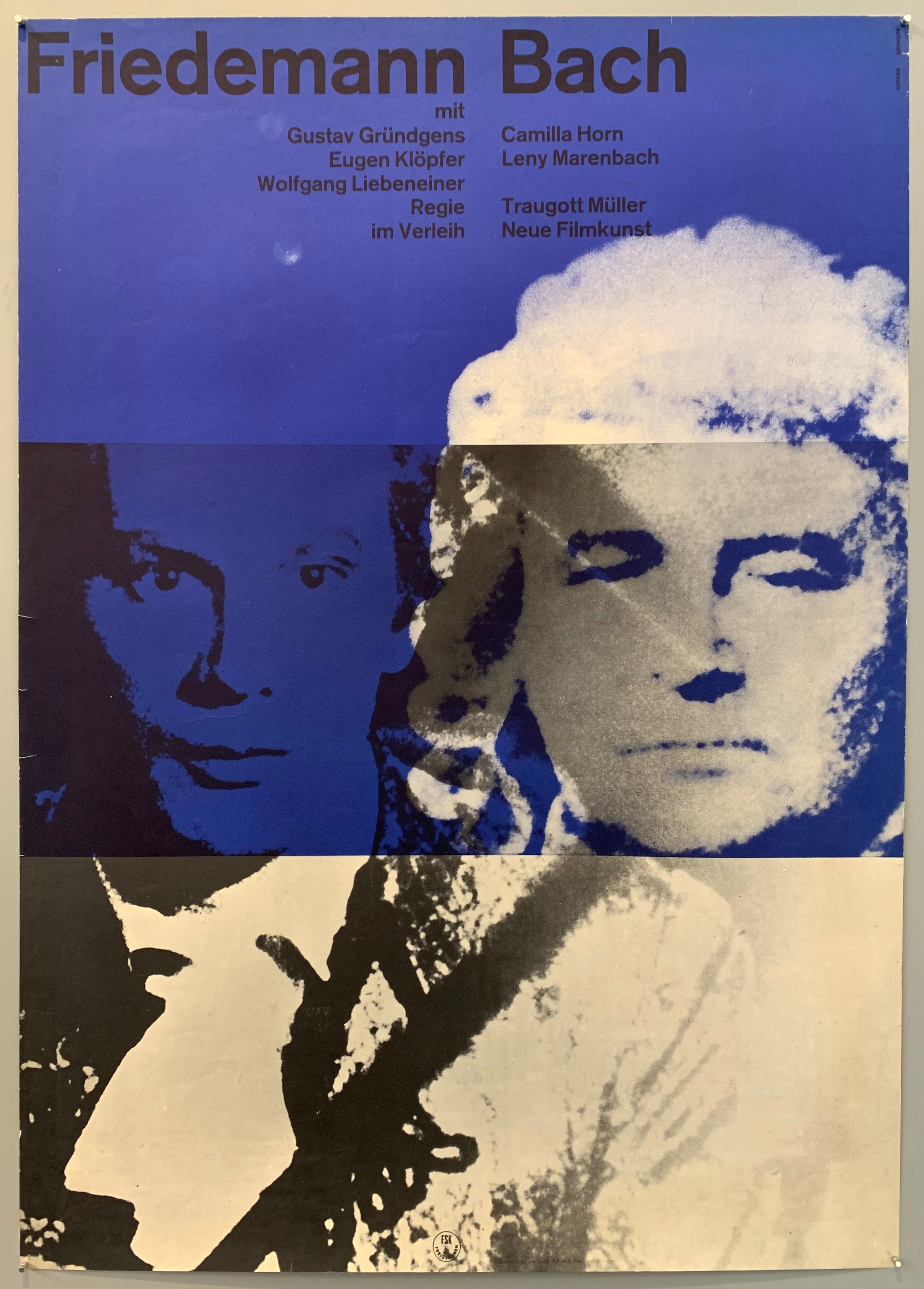Movie poster with what looks like silk screened images of two mens faces over a blue and white background.