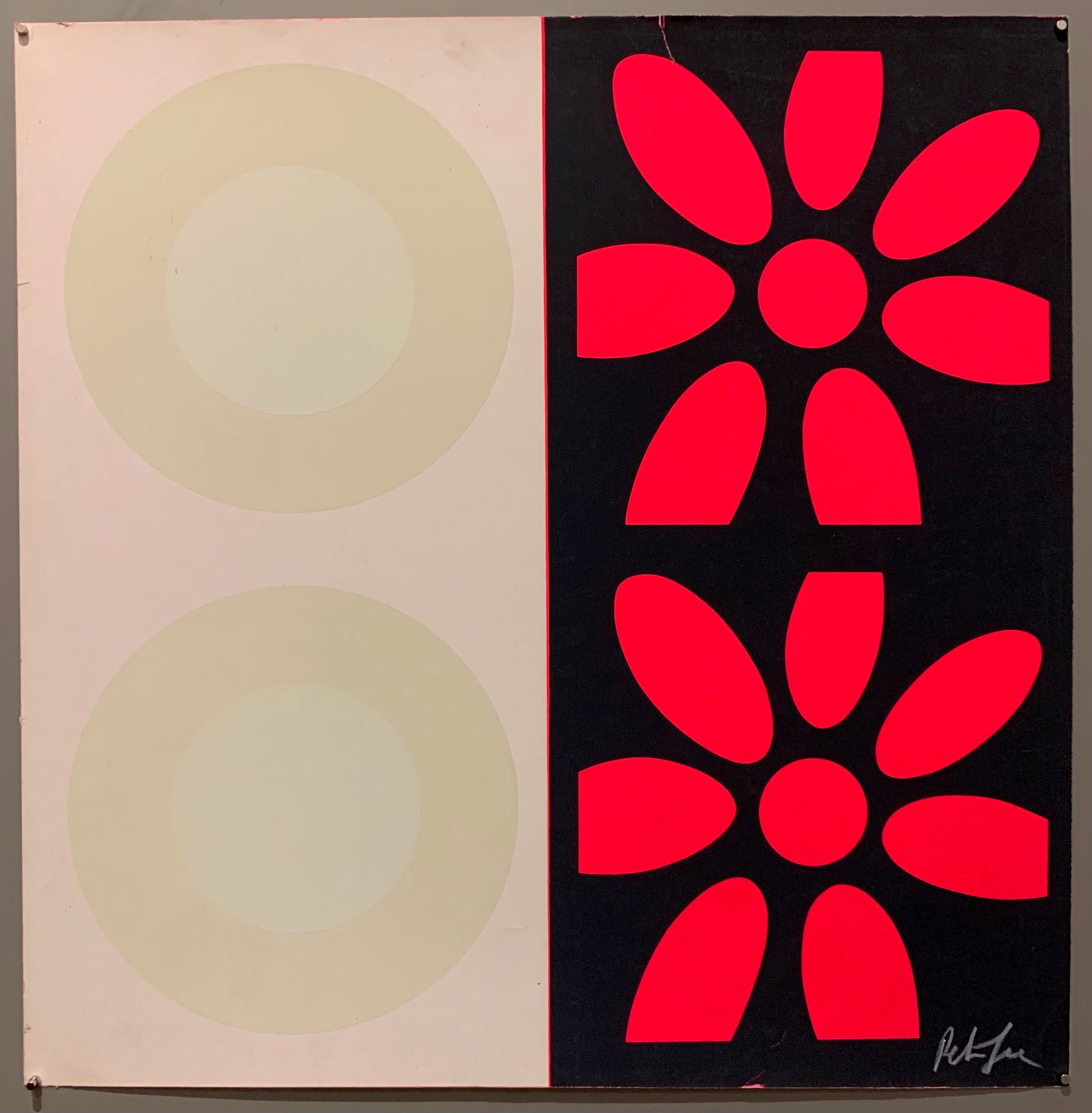 A square of four large motifs on paper. The colors are white with cream targets, the other is black with hot pink targets.