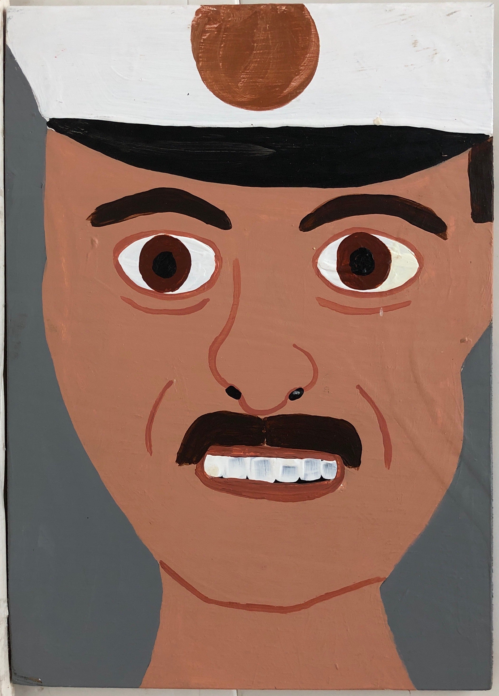 Portrait of Assistant Chief Gerard Barbara in a white firefighter's hat.