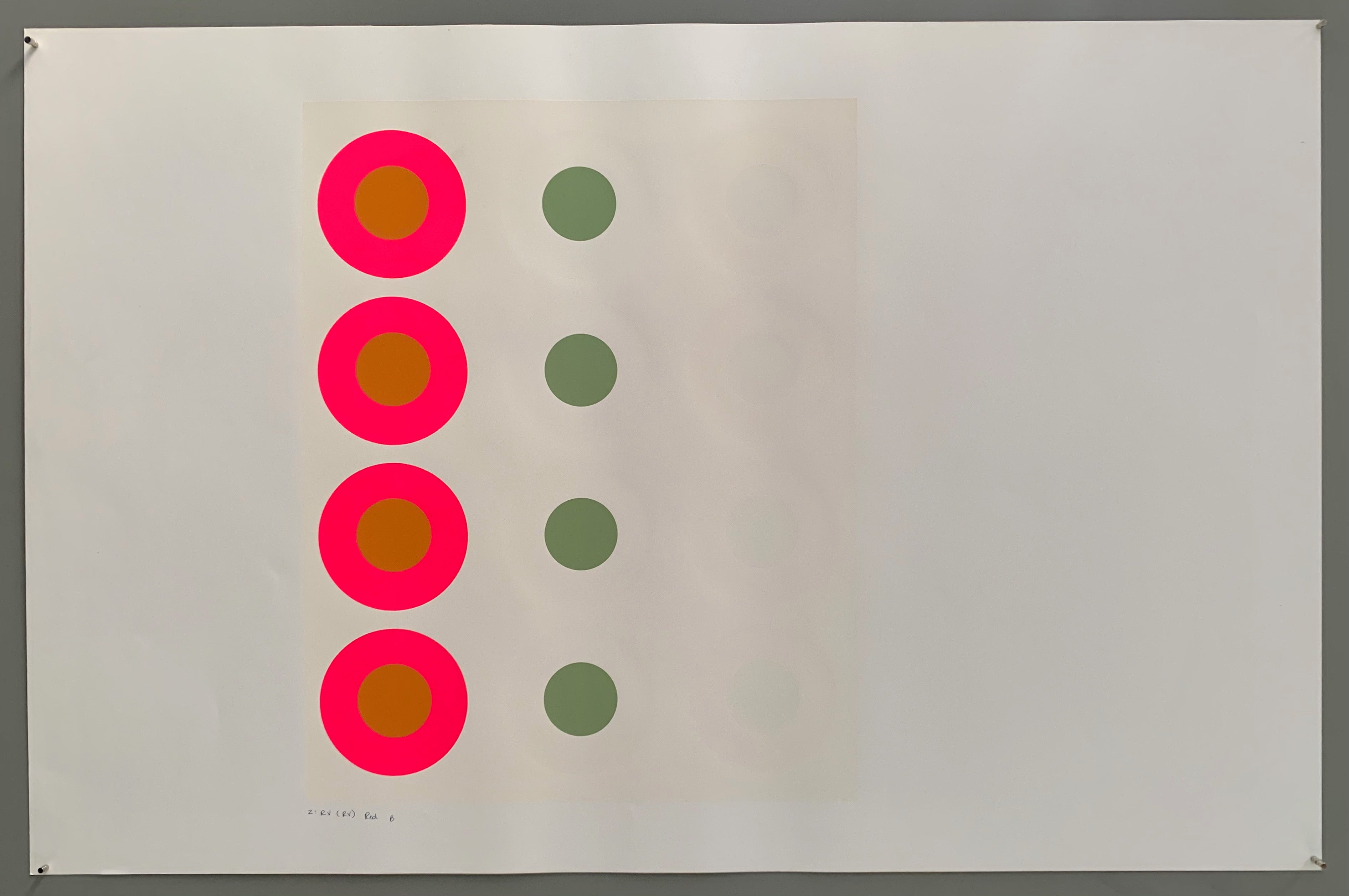 A rectangle made by three panels each holding a line of targets. The colors of this are quite brilliant— creamy whites and grays paired with a pop of neon pink, burnt ochre, and sage.