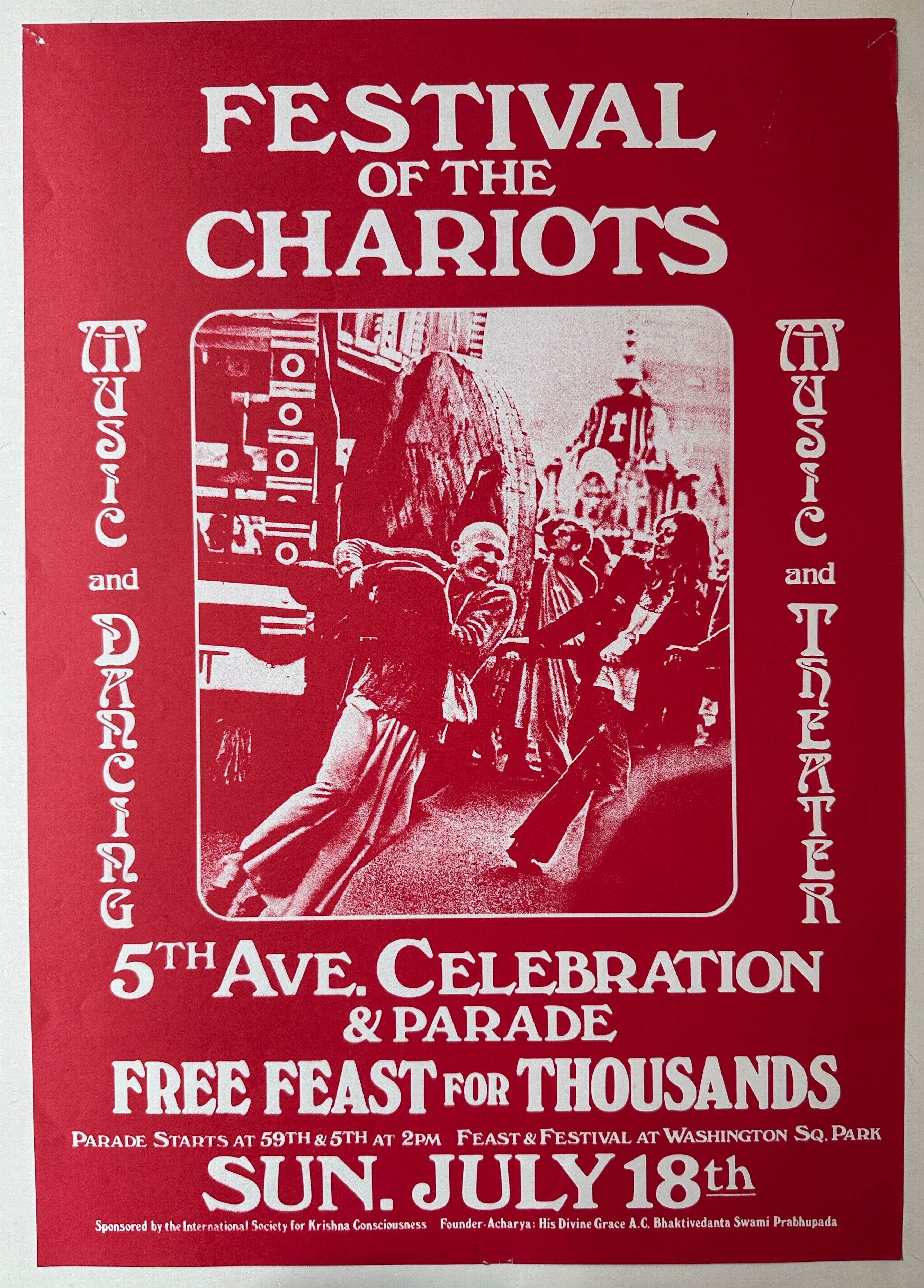 A red poster with white text surrounding a red-tinted photograph of people pulling on a chariot.