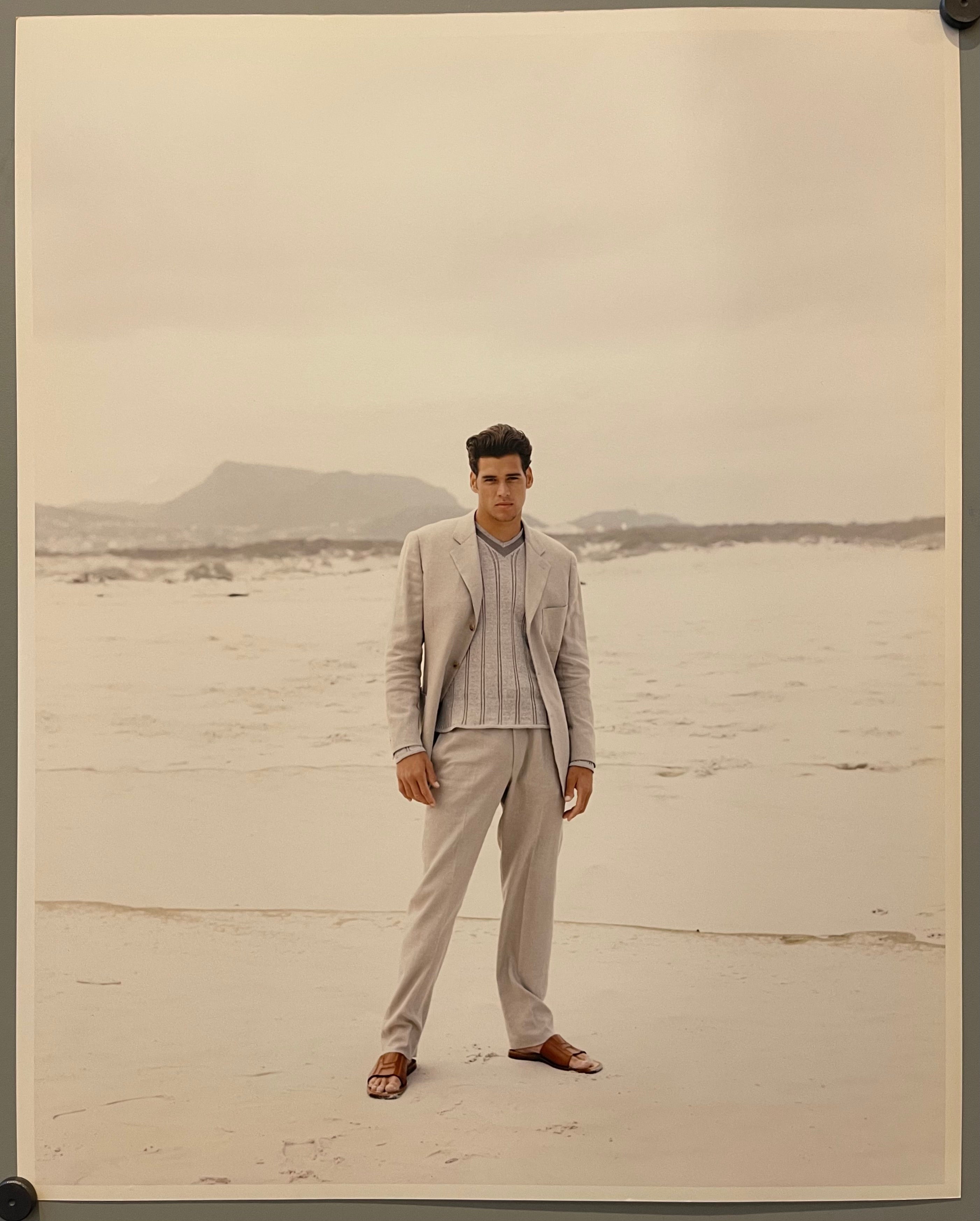 poster of a male model on a beach