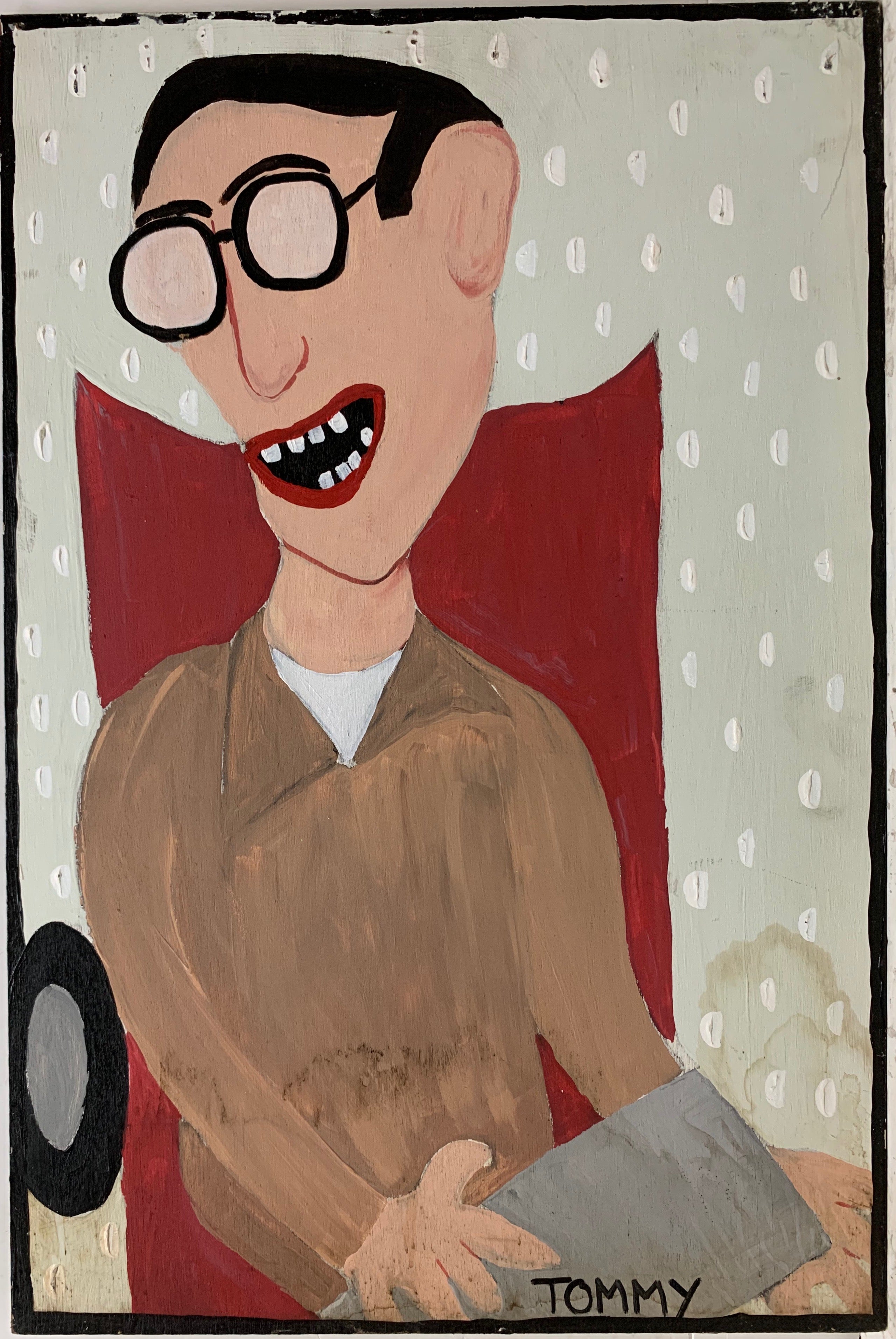 A Tommy Cheng portrait of Stephen Hawking laughing while he sits in his red wheelchair.