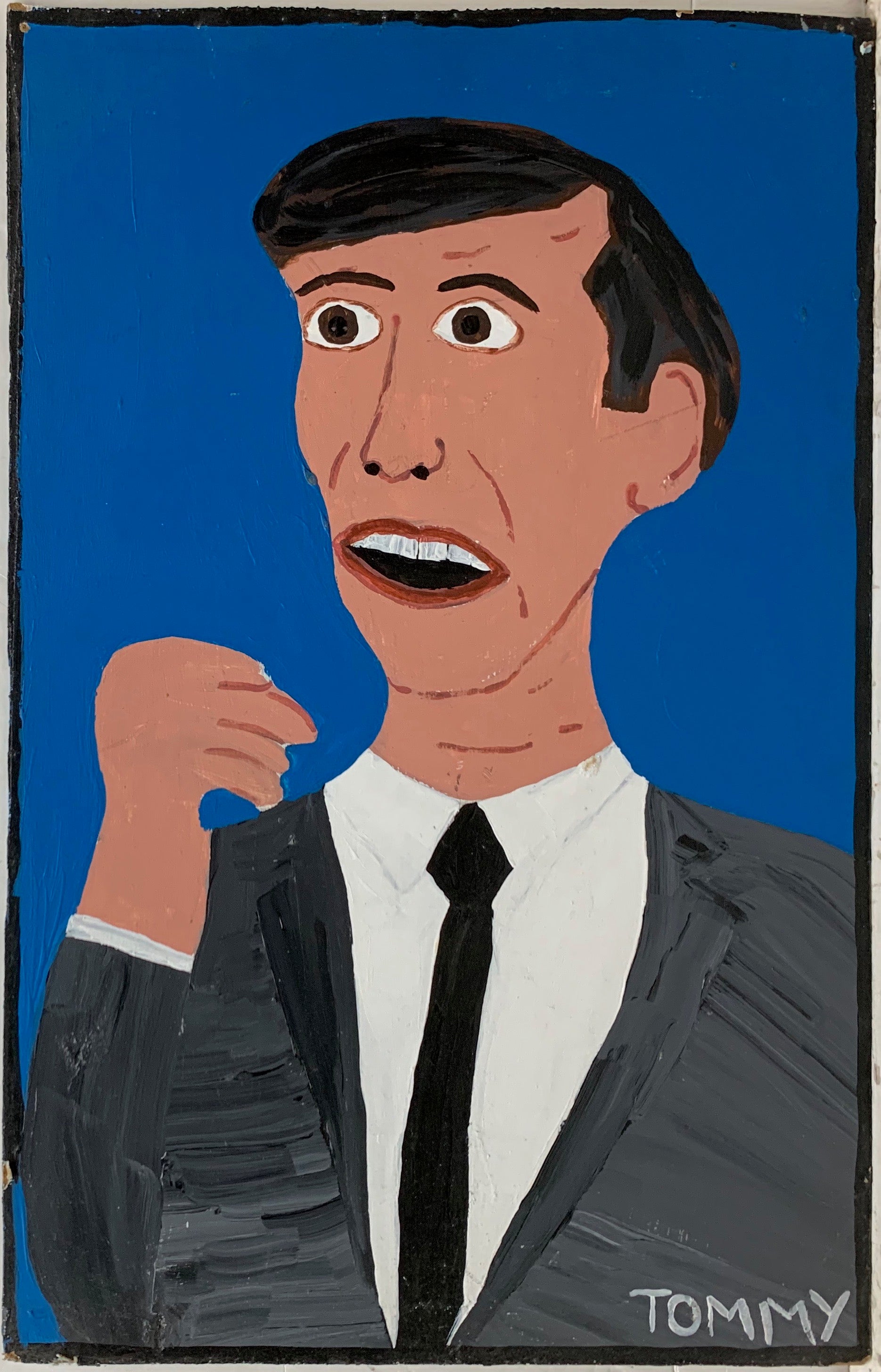 A Tommy Cheng portrait of a man in a black suit against a blue background, his mouth open in shock.
