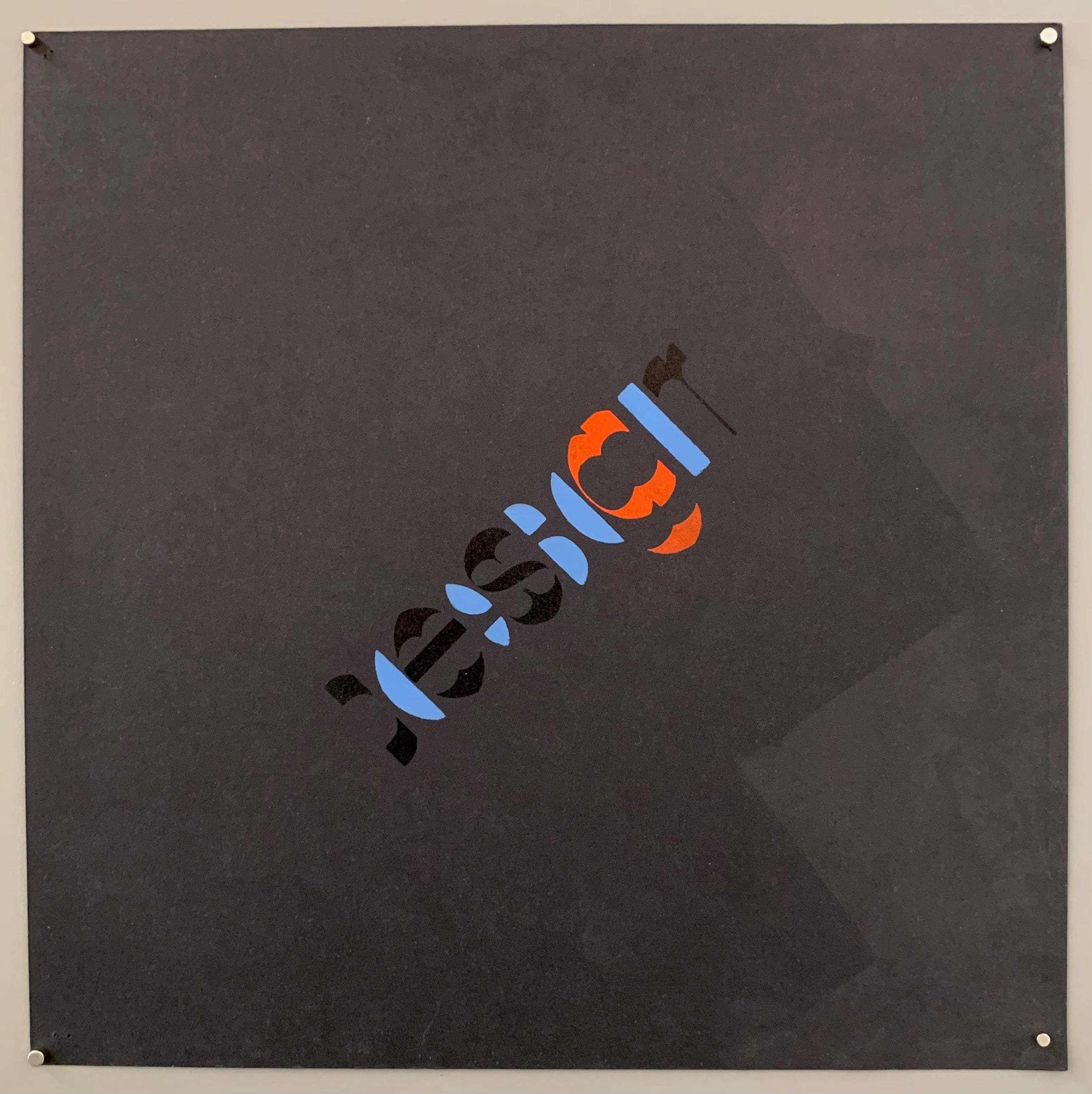 Black, blue, and red logo on a black poster