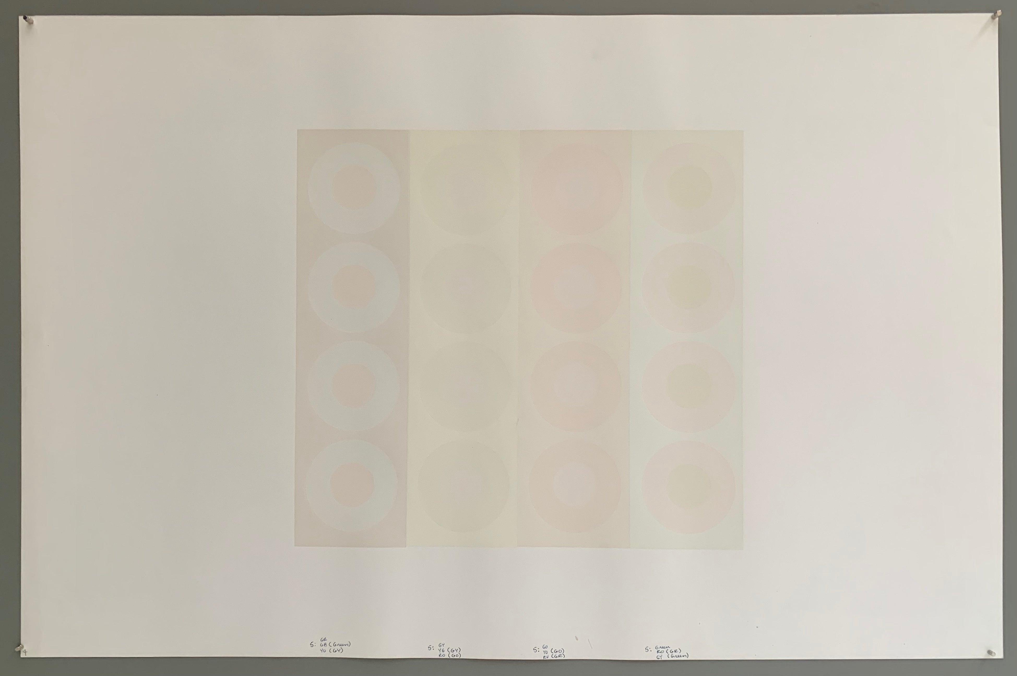 A rectangle made by three panels each holding a line of targets. The colors of this are quite lovely— creamy whites and greys mixed with the slightest hints of purple, pink, and blue.