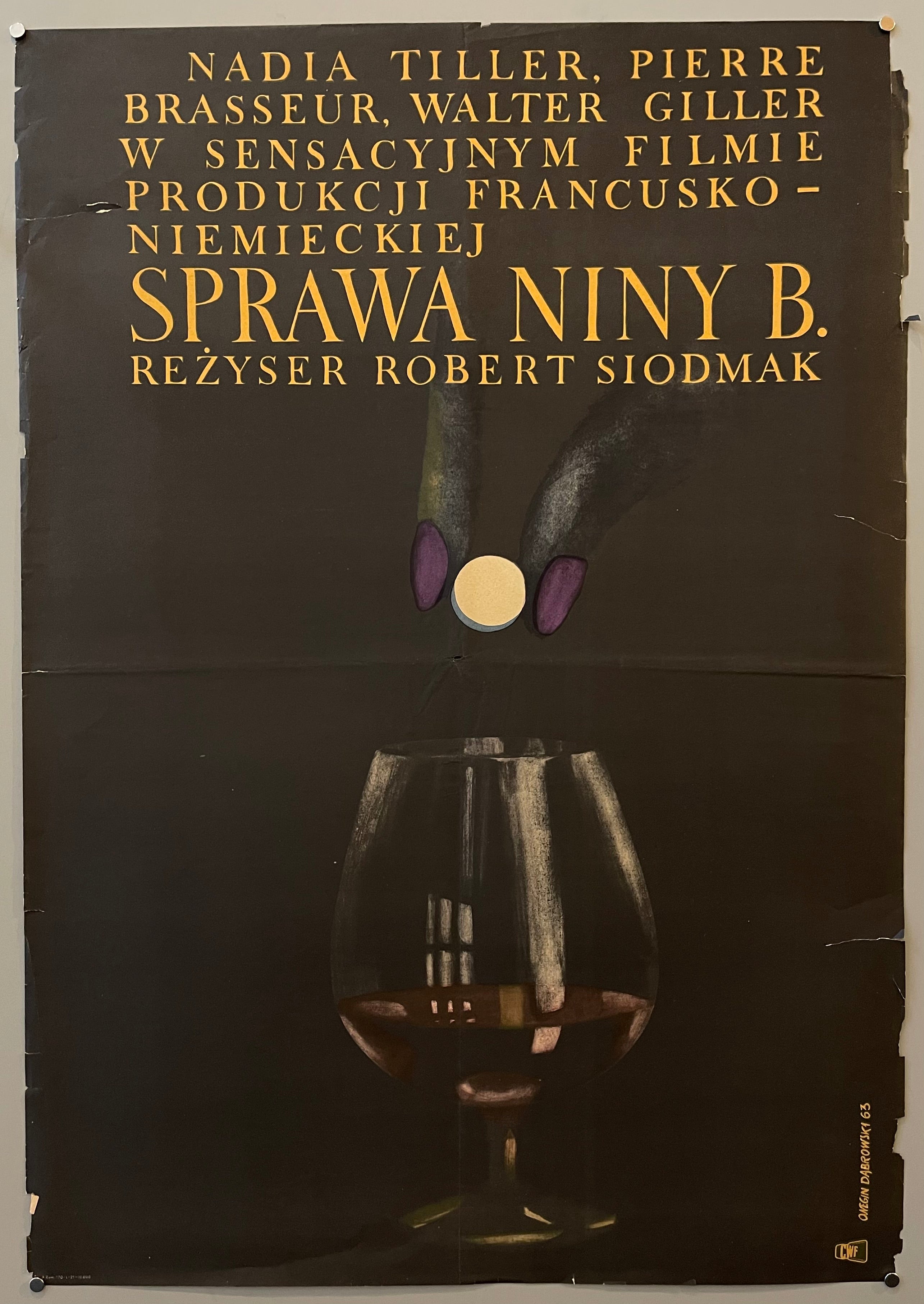 poster for a Polish film showing a woman's hand putting a pill into a glass of wine