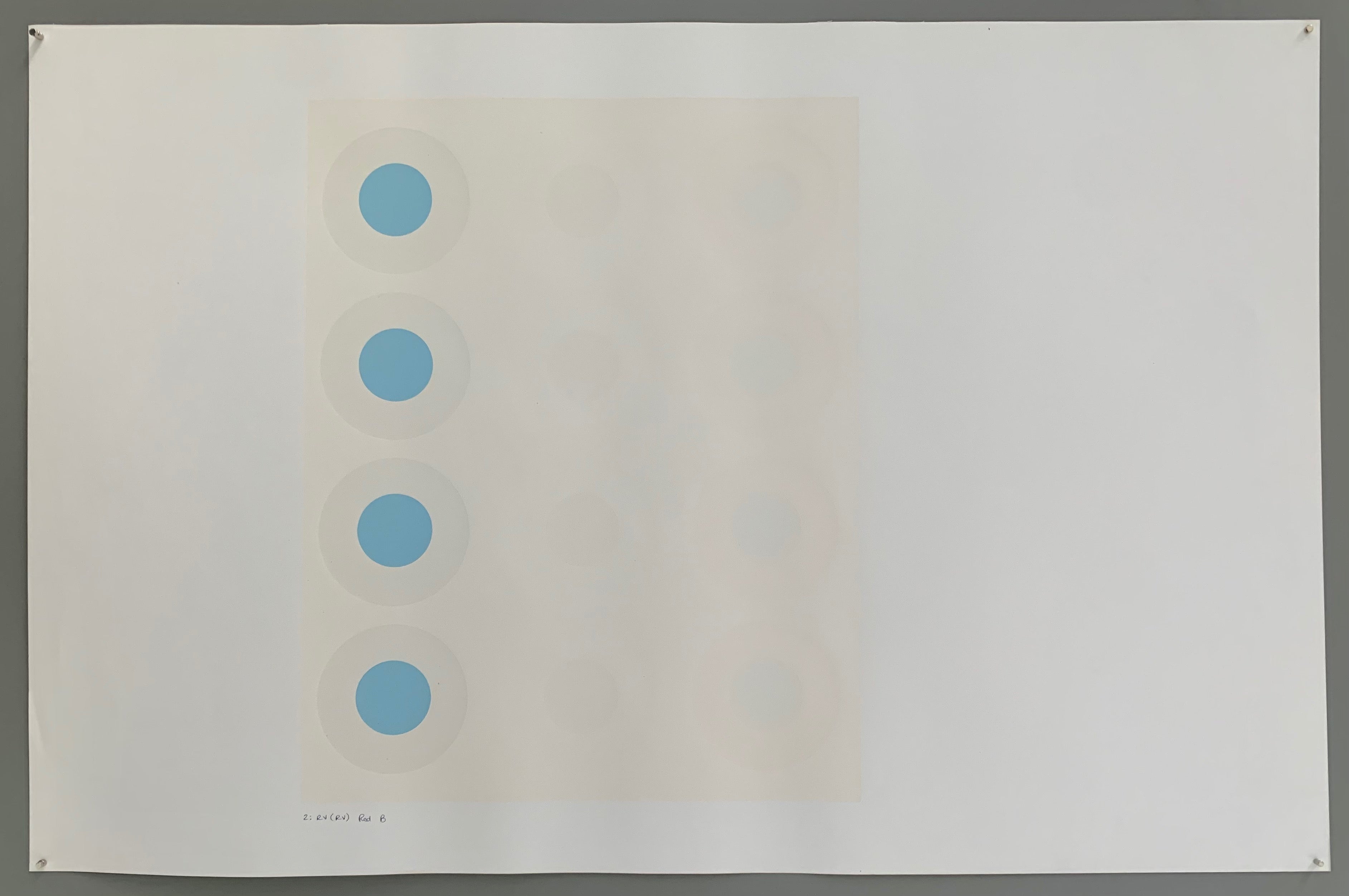 A rectangle made by three panels each holding a line of targets. The colors of this are quite nautical—light grey, white, cream, and a baby blue.