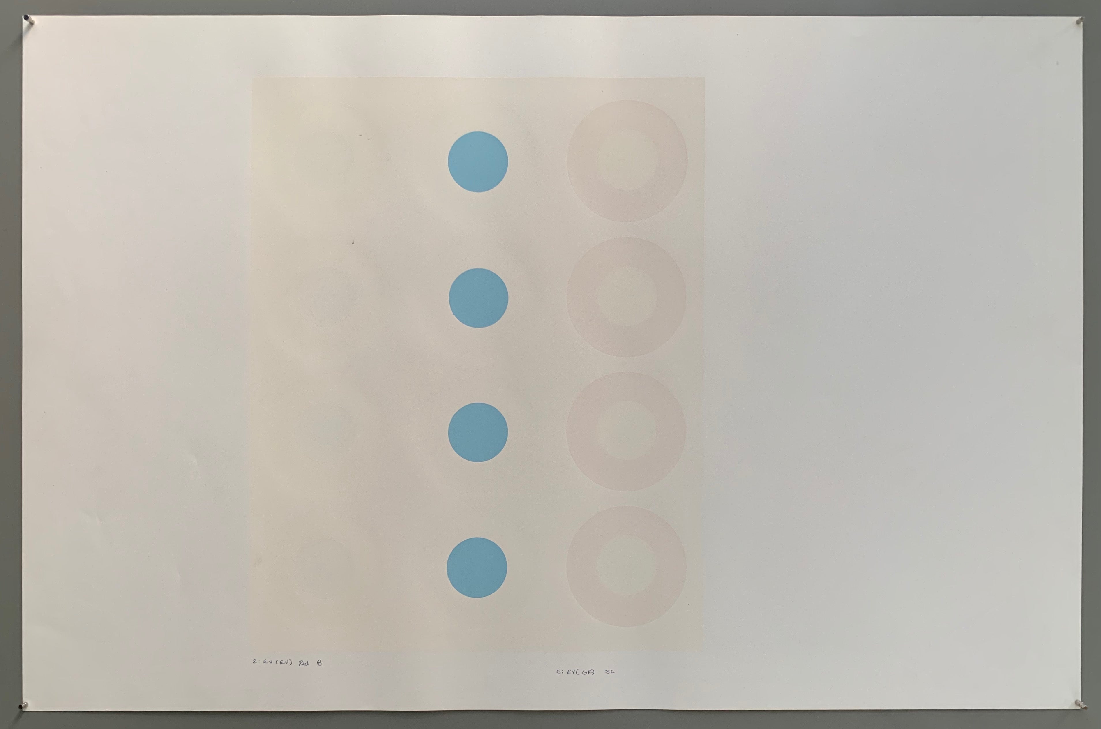 A rectangle made by three panels each holding a line of targets. The colors of this are quite nautical—light grey, white, cream, and a baby blue.