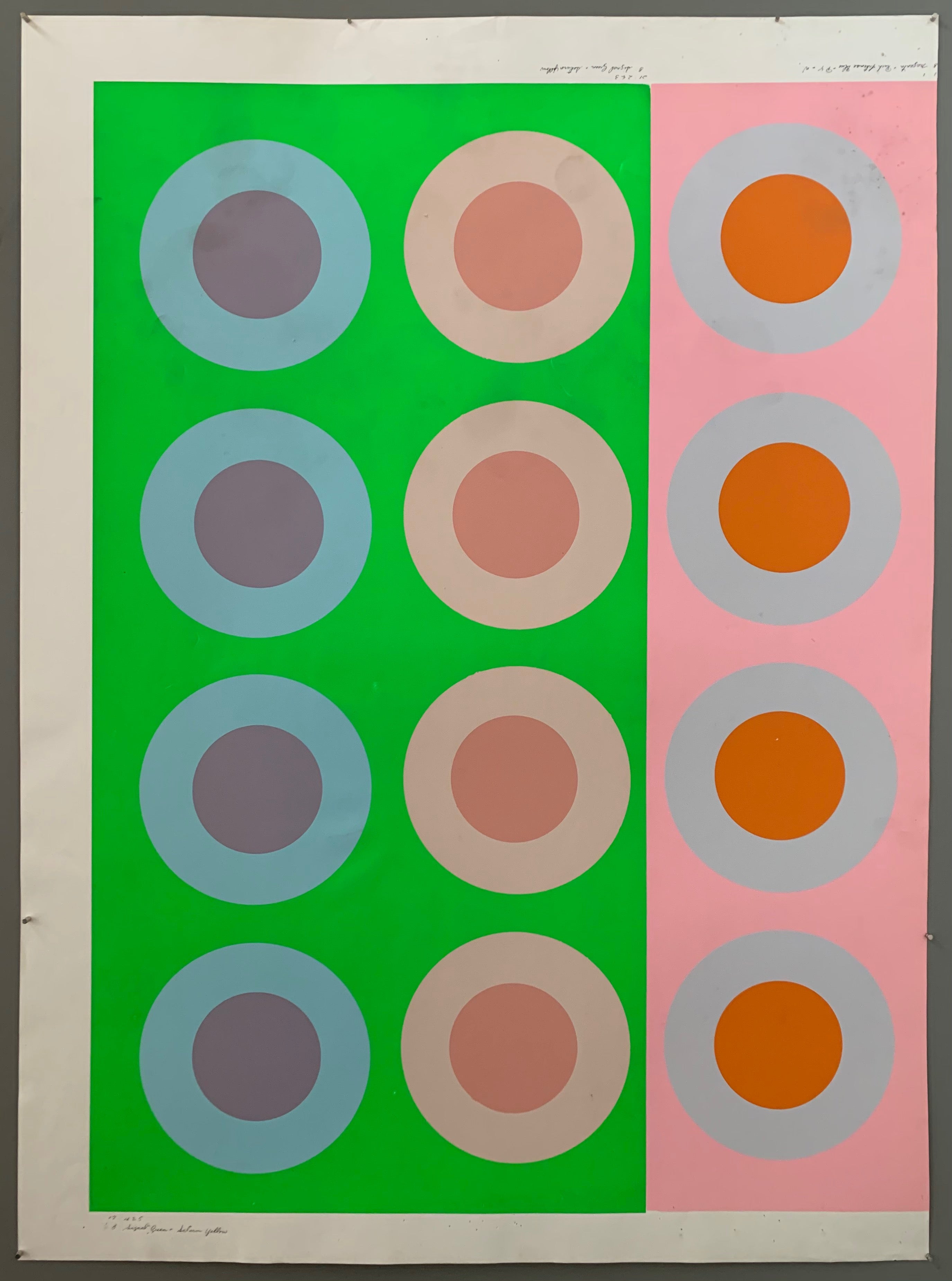 Two rows of targets on a green panel and one row of targets on a pink panel