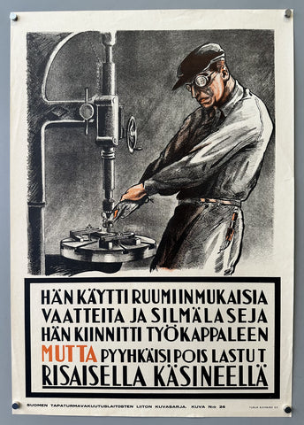 Hän käytti ruumiinmukaisia vaatteita ja silmälaseja hän kiinnitti työkappaleen mutta pyyhkäisi pois lastut risaisella käsineellä
